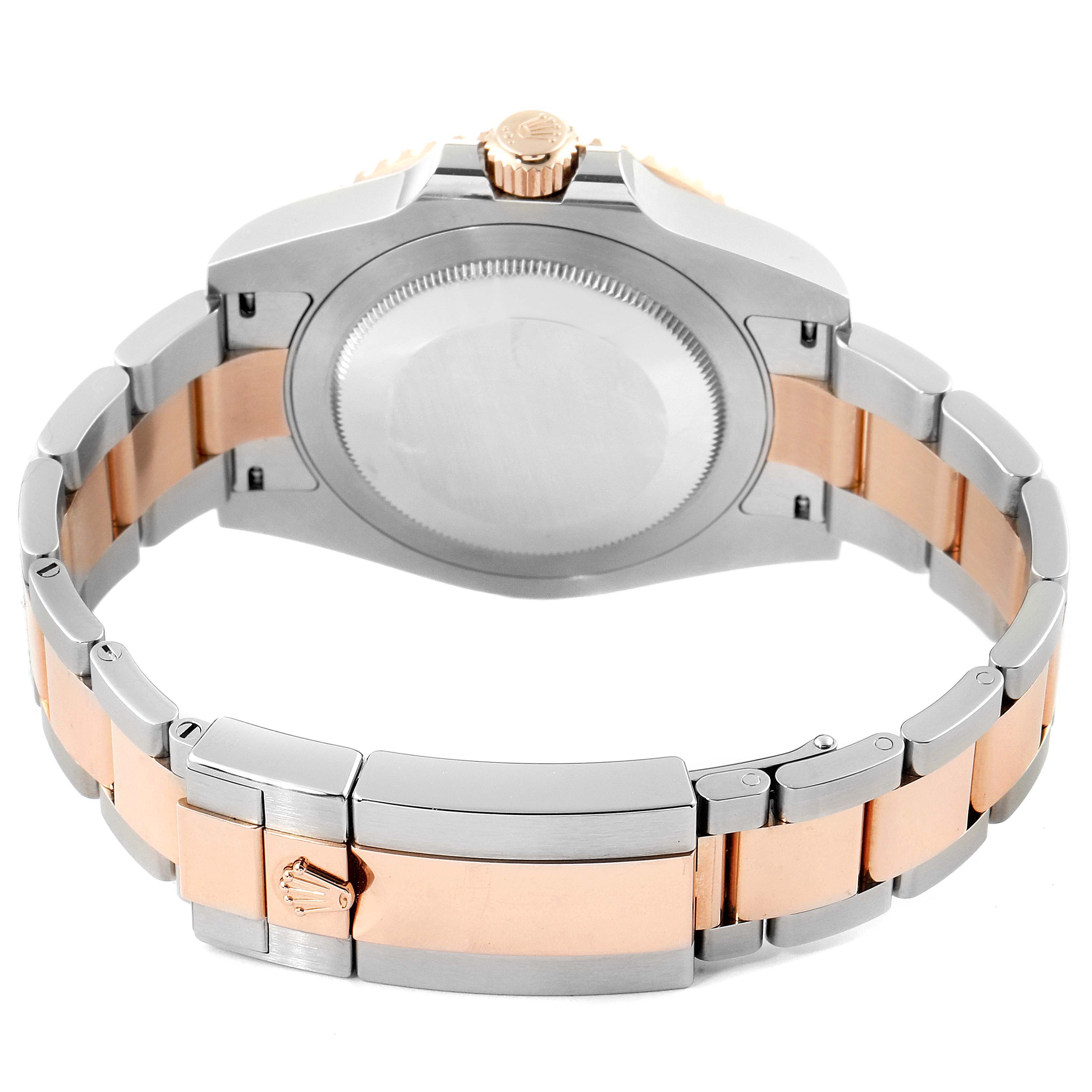 The image shows the back view of a Rolex GMT-Master 126711 Men's Stainless Steel Black Dial 126711 Men's Stainless Steel Black Dial watch, highlighting its two-tone metal bracelet and clasp.