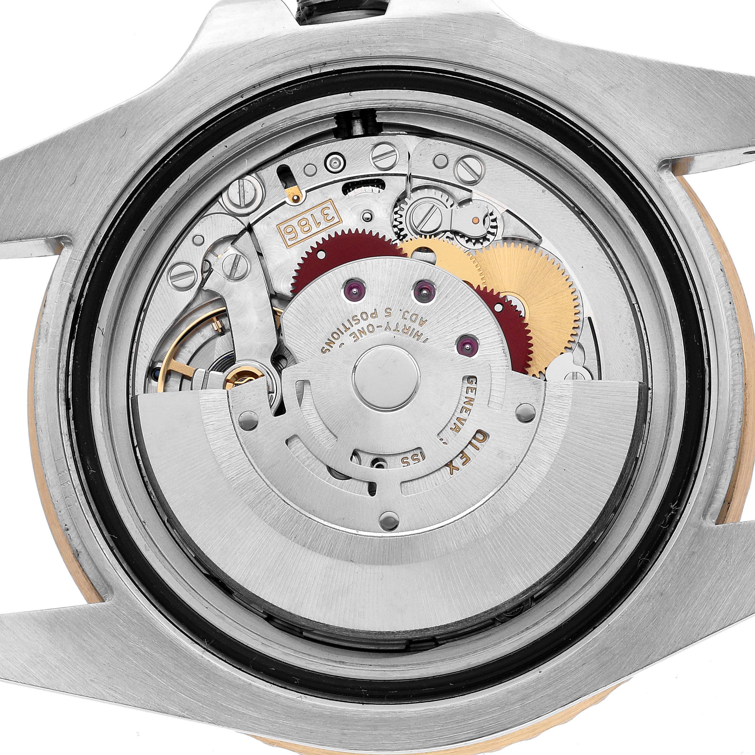 The image shows the back view of a Rolex GMT-Master 116713 Men's Steel and Gold (two tone) Black Dial, revealing its internal mechanical movement and rotor.