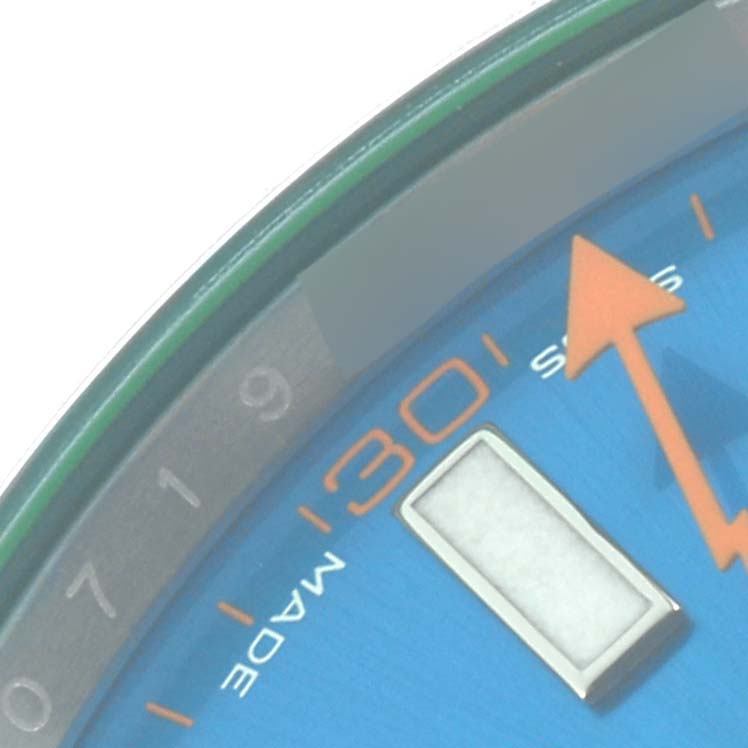 The image shows a close-up of the dial and markers of the Rolex Milgauss 116400GV Men's Stainless Steel Blue Dial 116400GV Men's Stainless Steel Blue Dial watch, highlighting the orange hand and minute markers.