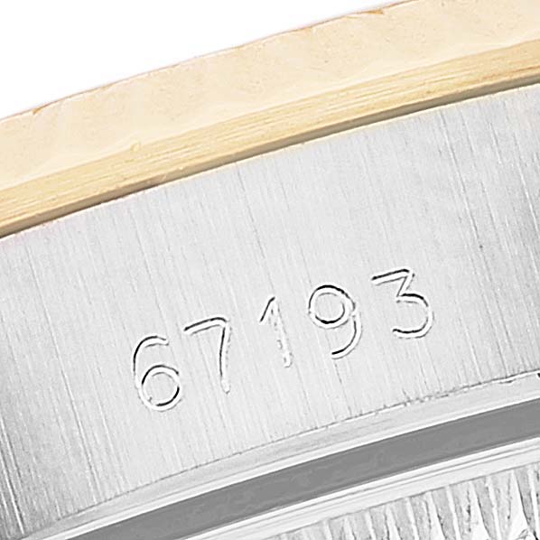This image shows a close-up of the side of a Rolex Oyster Perpetual 67193 Women's Steel and Gold (two tone) Champagne Dial 67193 Women's Steel and Gold (two tone) Champagne Dial watch case, displaying the model number "67193."