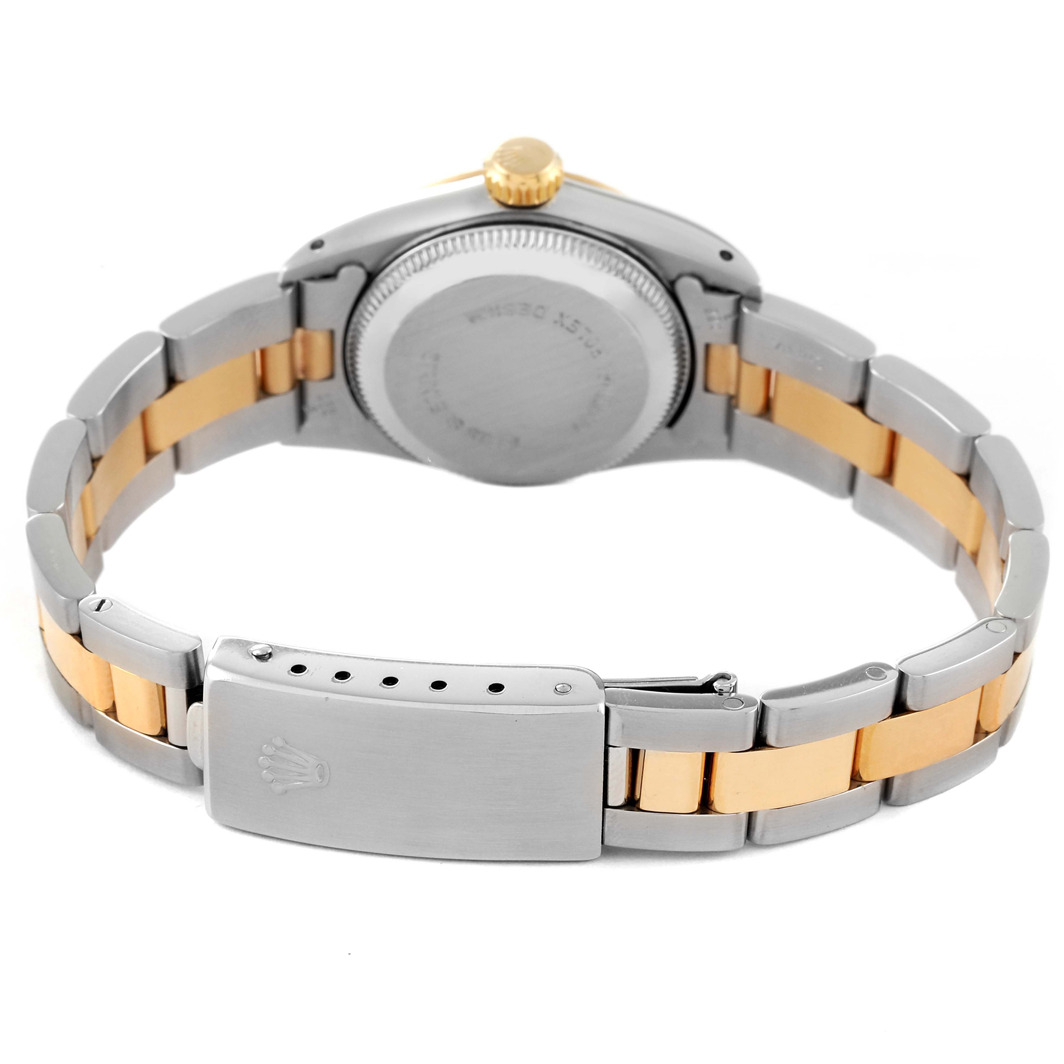 This Rolex Oyster Perpetual 67193 Women's Steel and Gold (two tone) Champagne Dial 67193 Women's Steel and Gold (two tone) Champagne Dial watch is shown from the back, showcasing its two-tone bracelet and clasp.