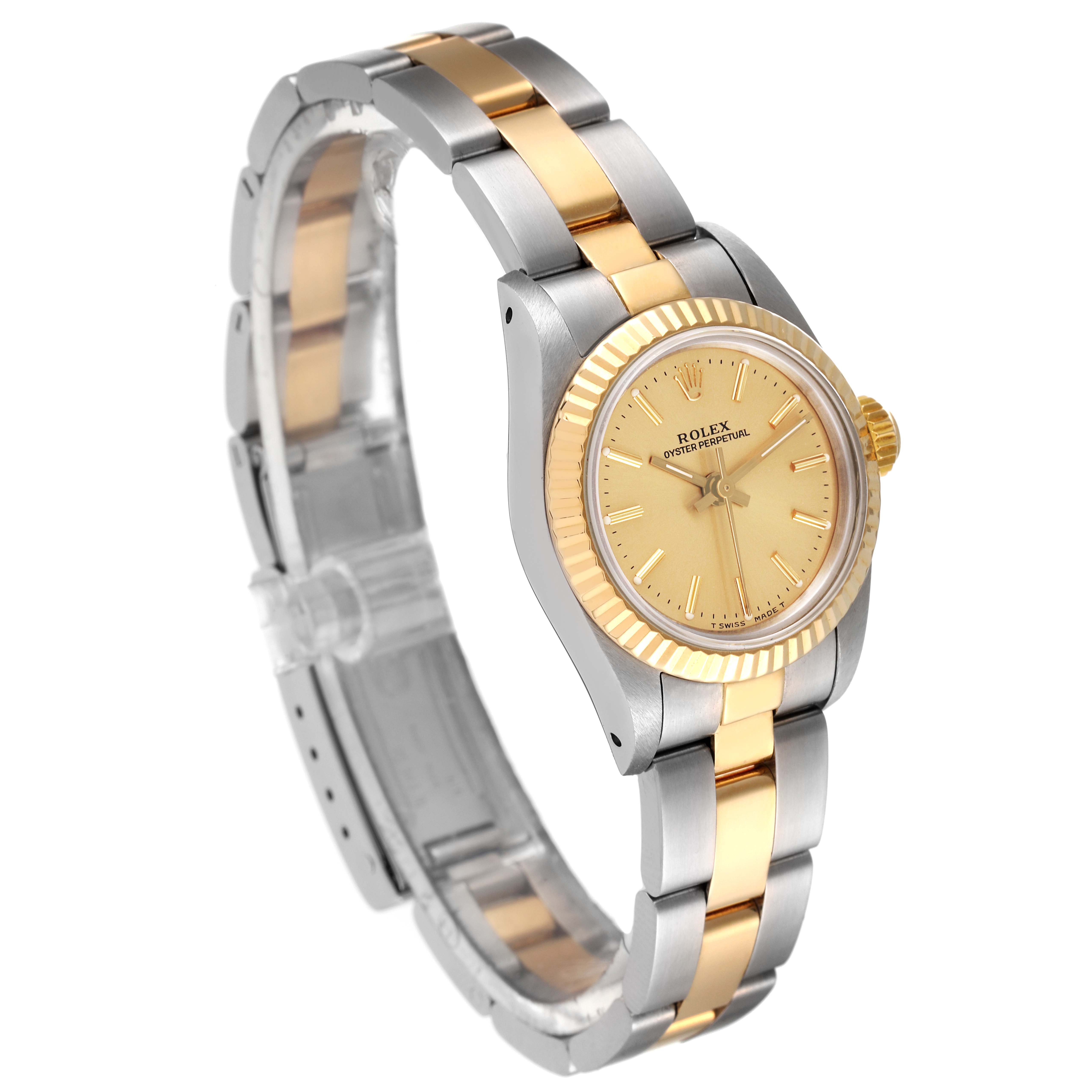 The Rolex Oyster Perpetual 67193 Women's Steel and Gold (two tone) Champagne Dial 67193 Women's Steel and Gold (two tone) Champagne Dial watch is shown at a three-quarter angle, displaying the face, bezel, and bracelet.