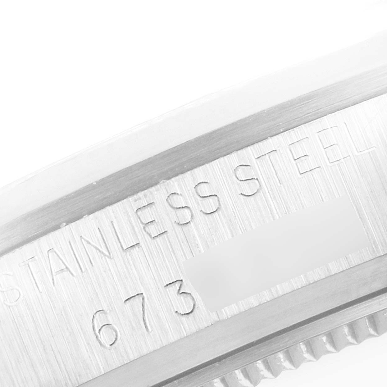 This close-up image shows the inner inscription of the bezel of the Rolex Vintage Collection 6466 Men's Stainless Steel Silver Dial 6466 Men's Stainless Steel Silver Dial model, made of stainless steel.