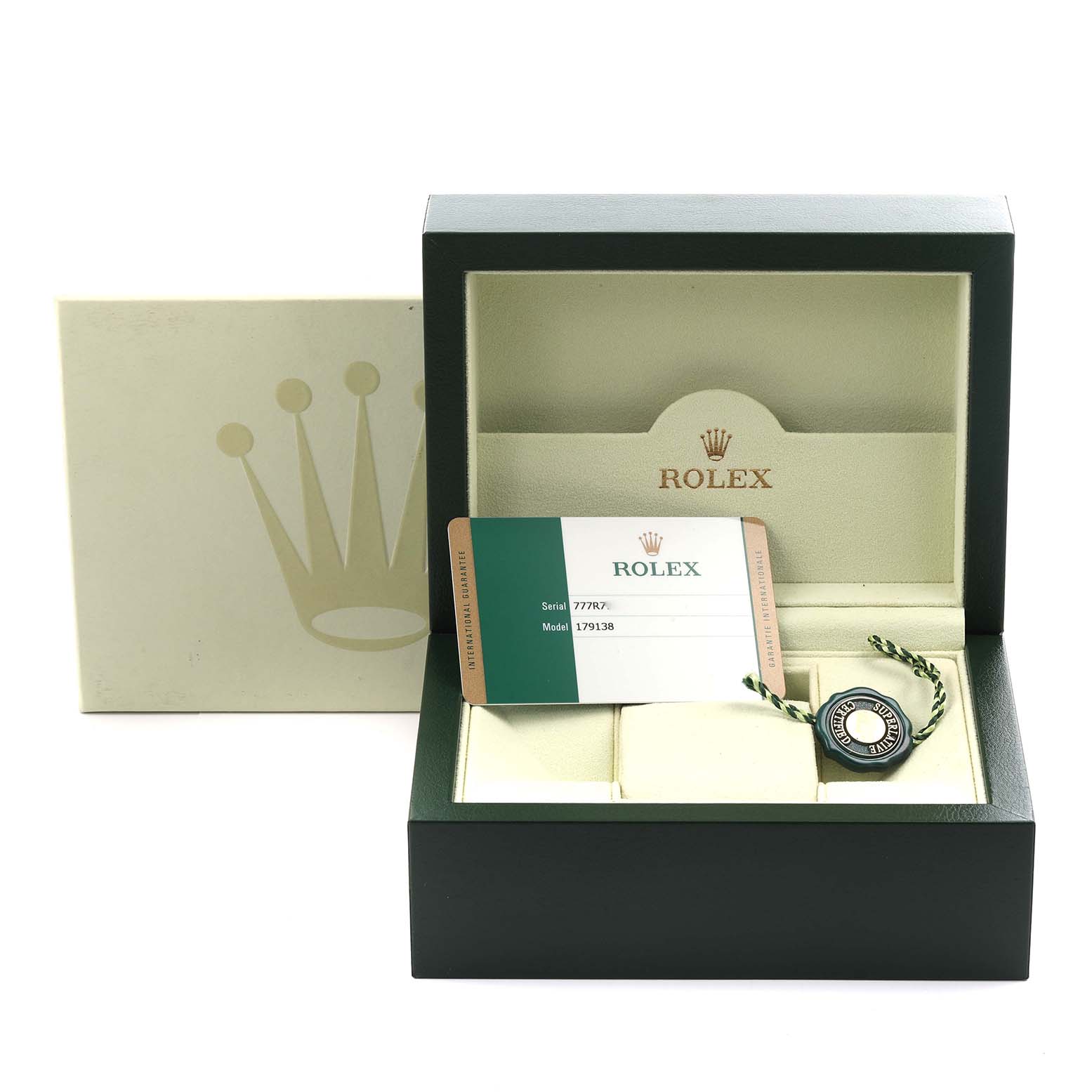 The image shows a Rolex President 179138 Women's Yellow Gold Champagne Dial 179138 Women's Yellow Gold Champagne Dial model's box, warranty card, and tag with a partial view inside the box.