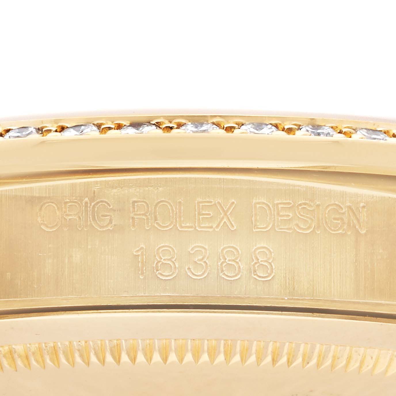 The image shows an angled close-up of the Rolex President 18388 Men's Yellow Gold Champagne Dial 18388 Men's Yellow Gold Champagne Dial model's side, featuring the model number and diamond-set bezel.