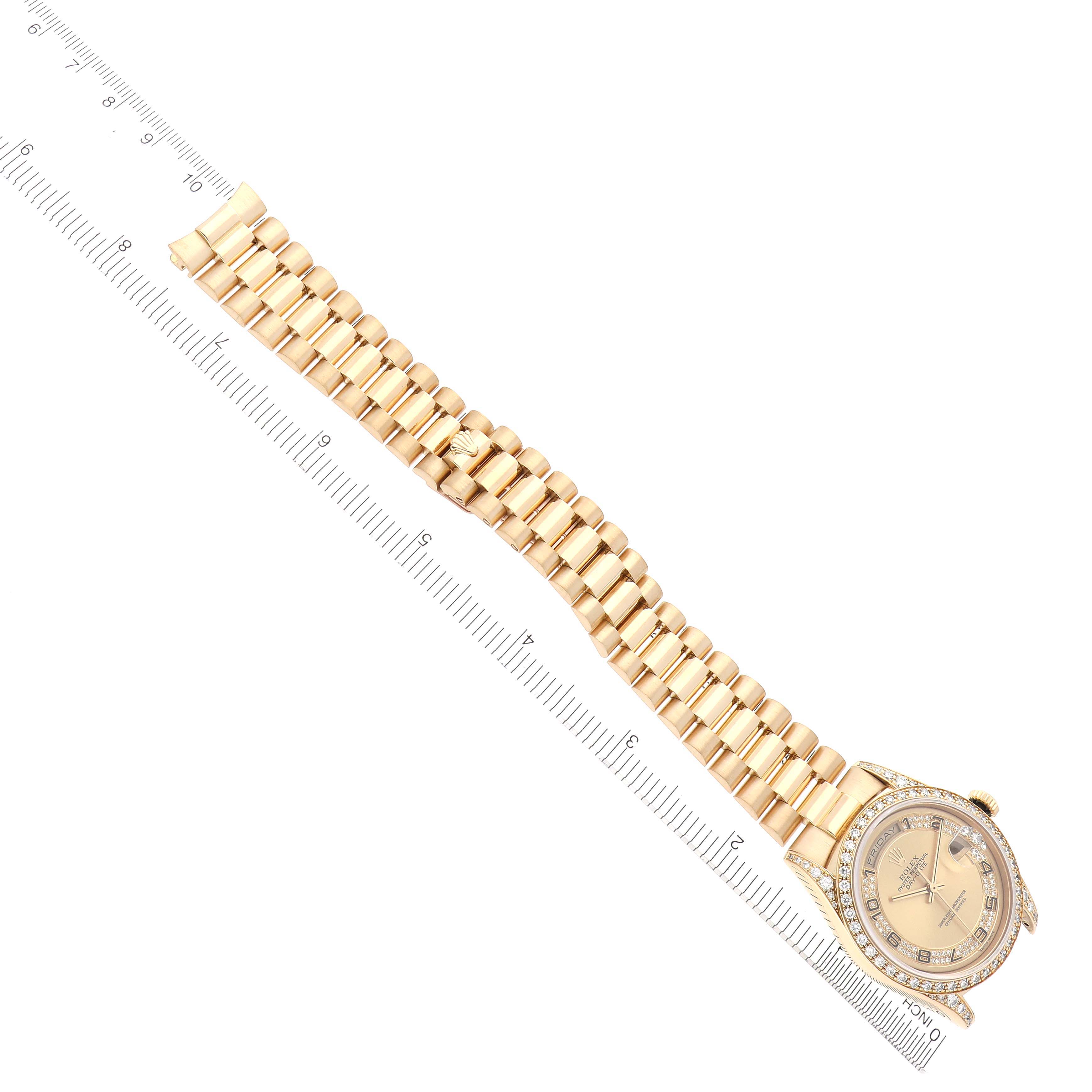 The Rolex President 18388 Men's Yellow Gold Champagne Dial 18388 Men's Yellow Gold Champagne Dial model watch is shown from a top angle, displaying the full bracelet and face alongside a measuring ruler.
