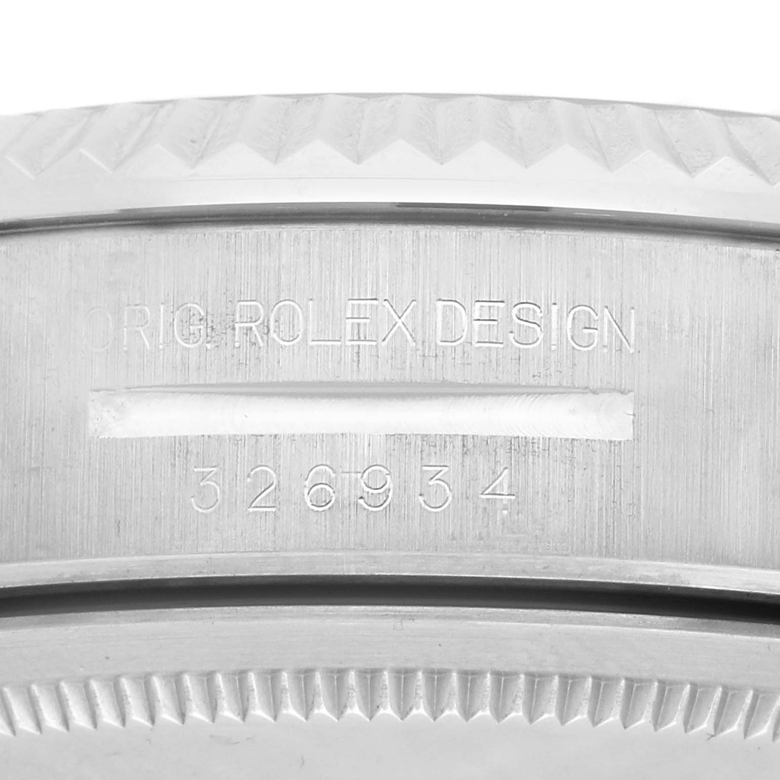 The image shows a close-up of the bezel edge and engraved text of the Rolex Sky-Dweller 326934 Men's Stainless Steel Blue Dial watch.