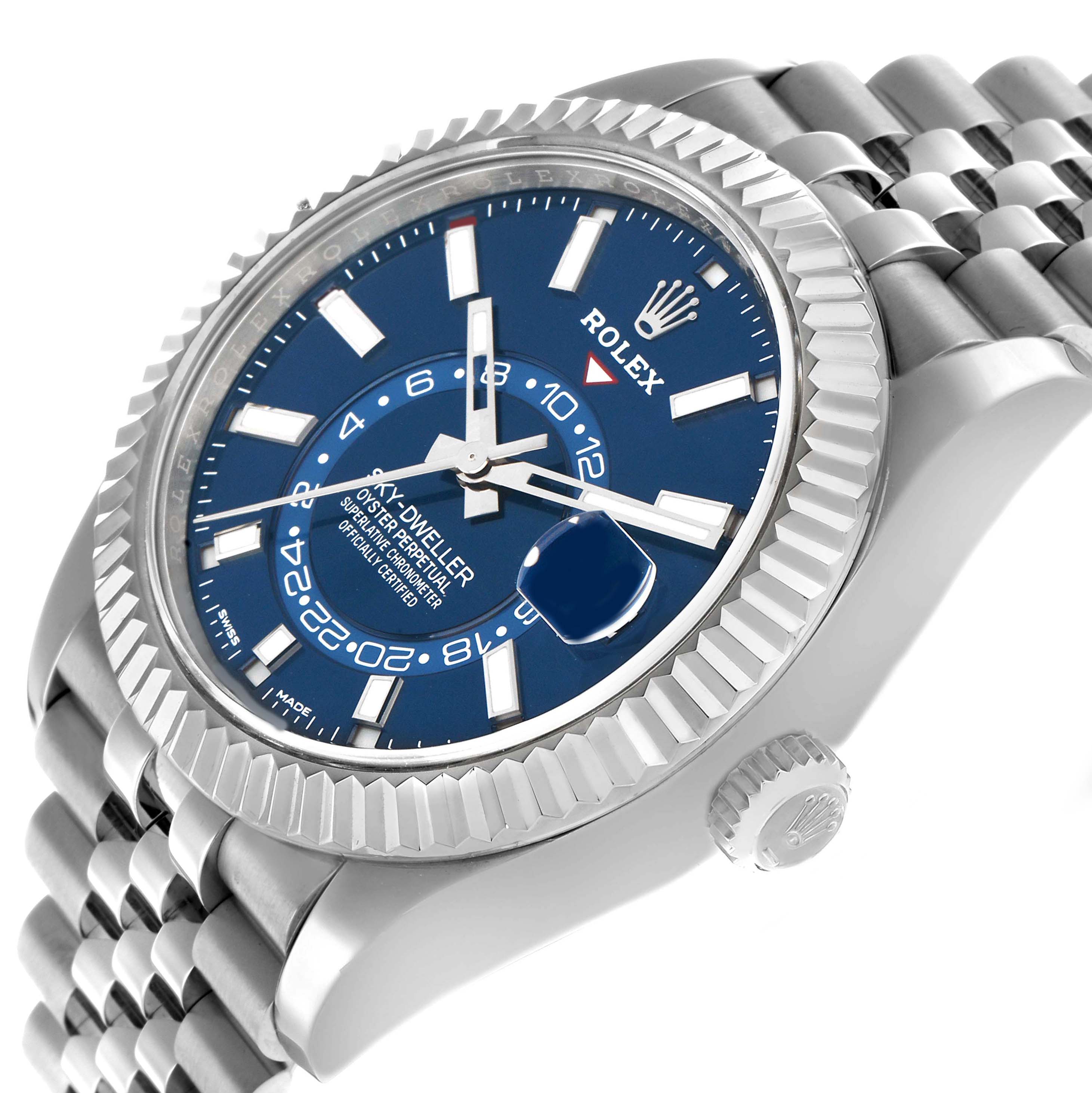 The Rolex Sky-Dweller 326934 Men's Stainless Steel Blue Dial is shown at a slight side angle, highlighting the blue dial, fluted bezel, crown, and bracelet.