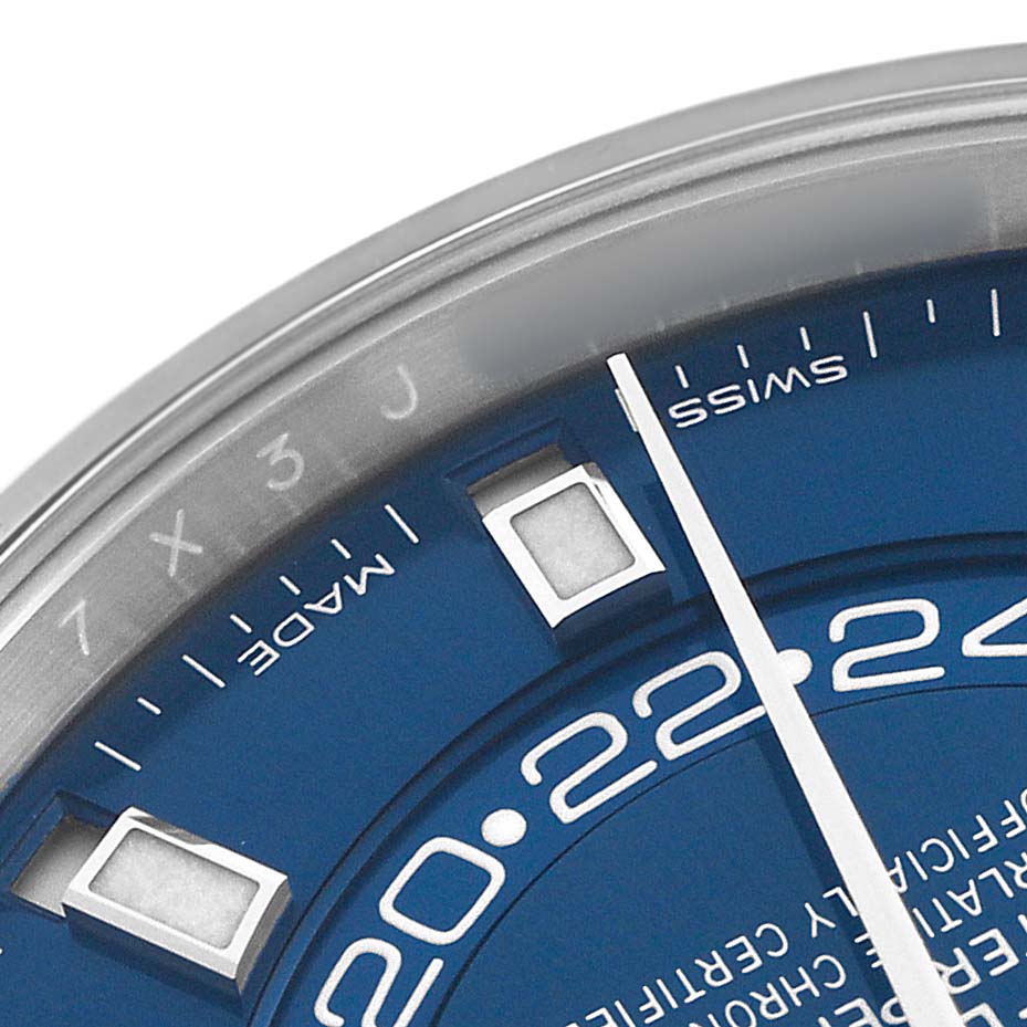 This image shows a close-up of the blue face and partial bezel of a Rolex Sky-Dweller 326934 Men's Stainless Steel Blue Dial watch, highlighting the hour markers and hands.