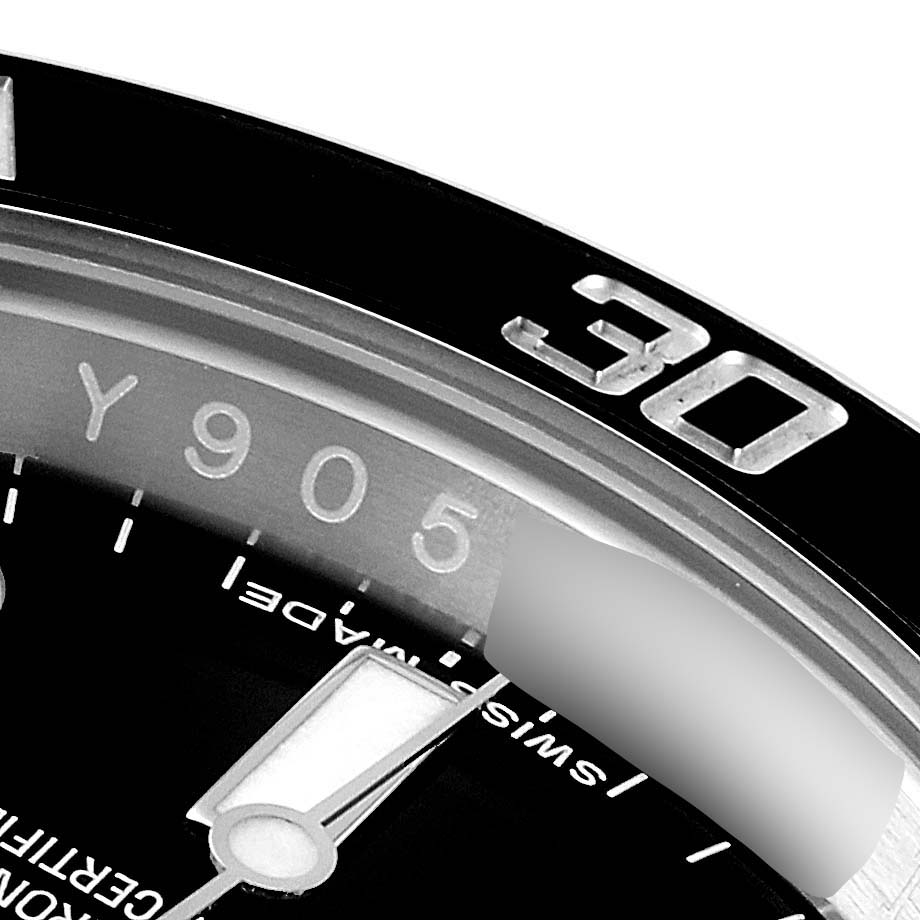 The image shows a close-up of a Rolex Submariner 114060 Men's Stainless Steel Black Dial 114060 Men's Stainless Steel Black Dial watch featuring the bezel with the number "30" and part of the minute hand.