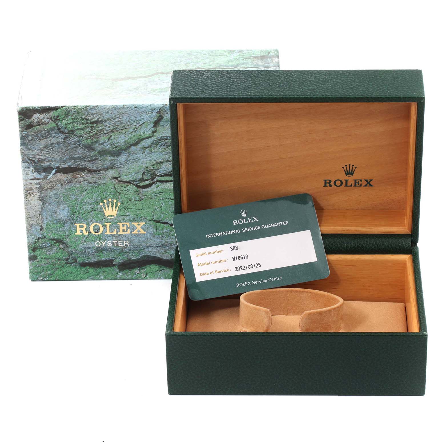 The image shows a Rolex Submariner 16613 Men's Steel and Gold (two tone) Blue Dial 16613 Men's Steel and Gold (two tone) Blue Dial watch box, an international service guarantee card, and the cushion inside the box.