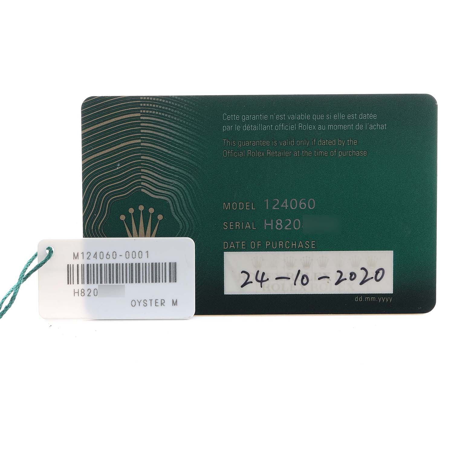The image shows a warranty card and tag for a Rolex Submariner 124060 Men's Stainless Steel Black Dial model.