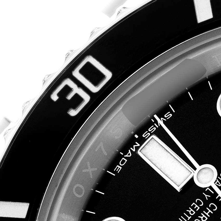 The image shows a close-up of the Rolex Submariner 114060 Men's Stainless Steel Black Dial's bezel and dial, highlighting the number "30" and part of the watch face.