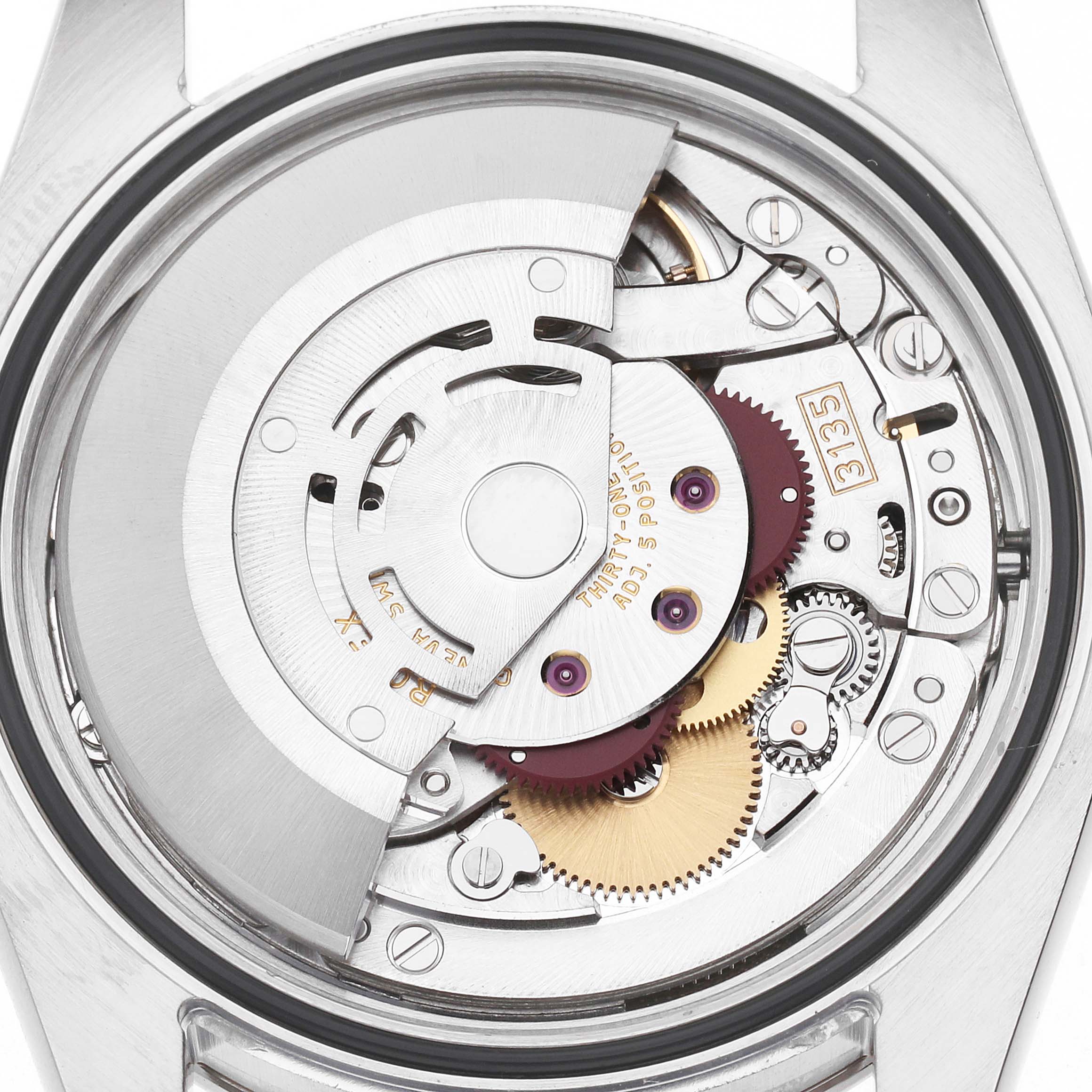 The image shows the movement of a Rolex Turn-o-Graph 116264 Men's Stainless Steel Black Dial watch from a top-down angle, displaying its intricate mechanical components.