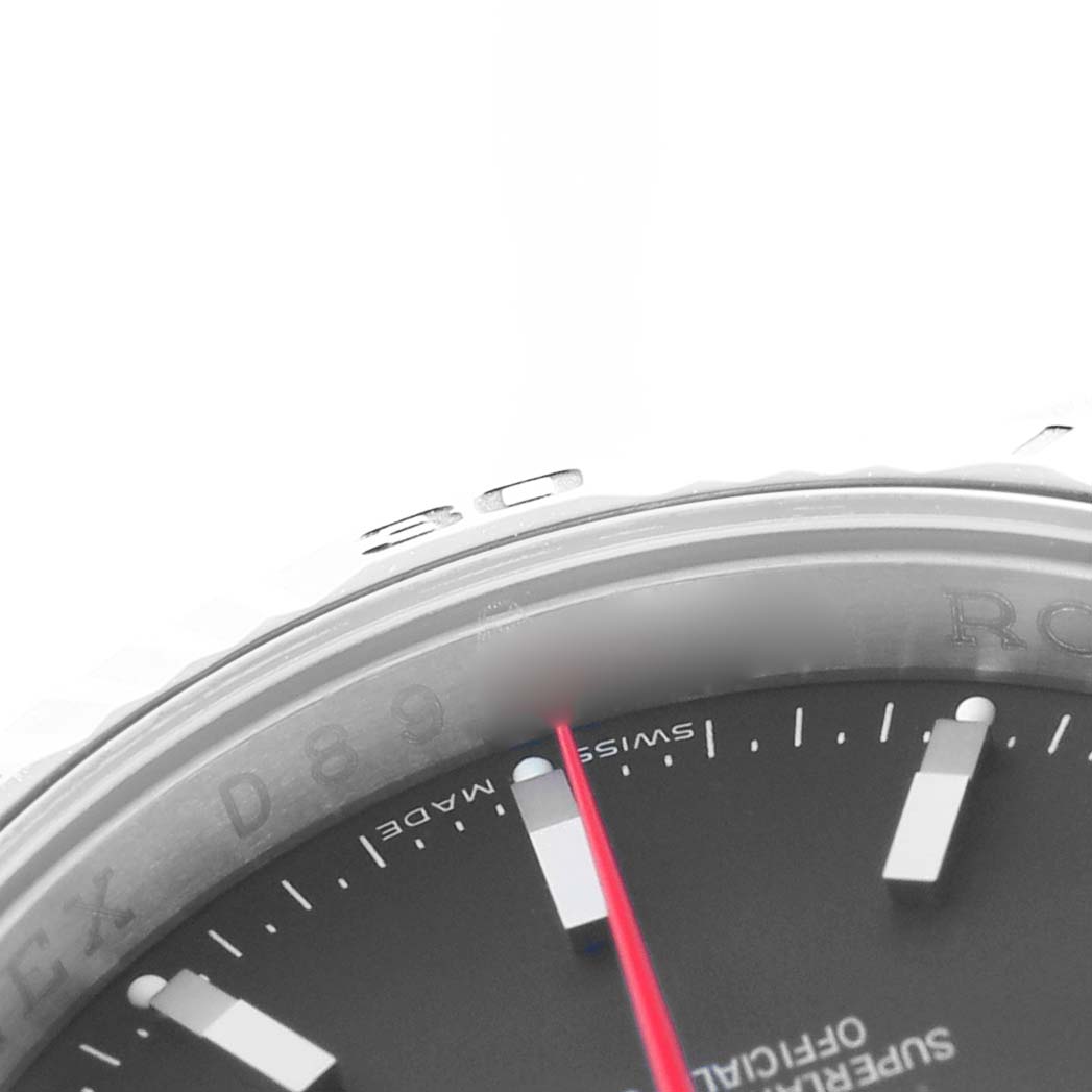 The image shows a close-up of the Rolex Turn-o-Graph 116264 Men's Stainless Steel Black Dial's bezel, dial, and red second hand at an angled view.