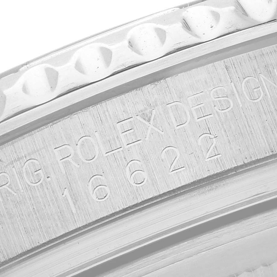 The image shows a close-up of the Rolex Yacht-Master 16622 Men
s Stainless Steel Silver Dial 16622 Men
s Stainless Steel Silver Dial model
s engraved bezel and case edge.