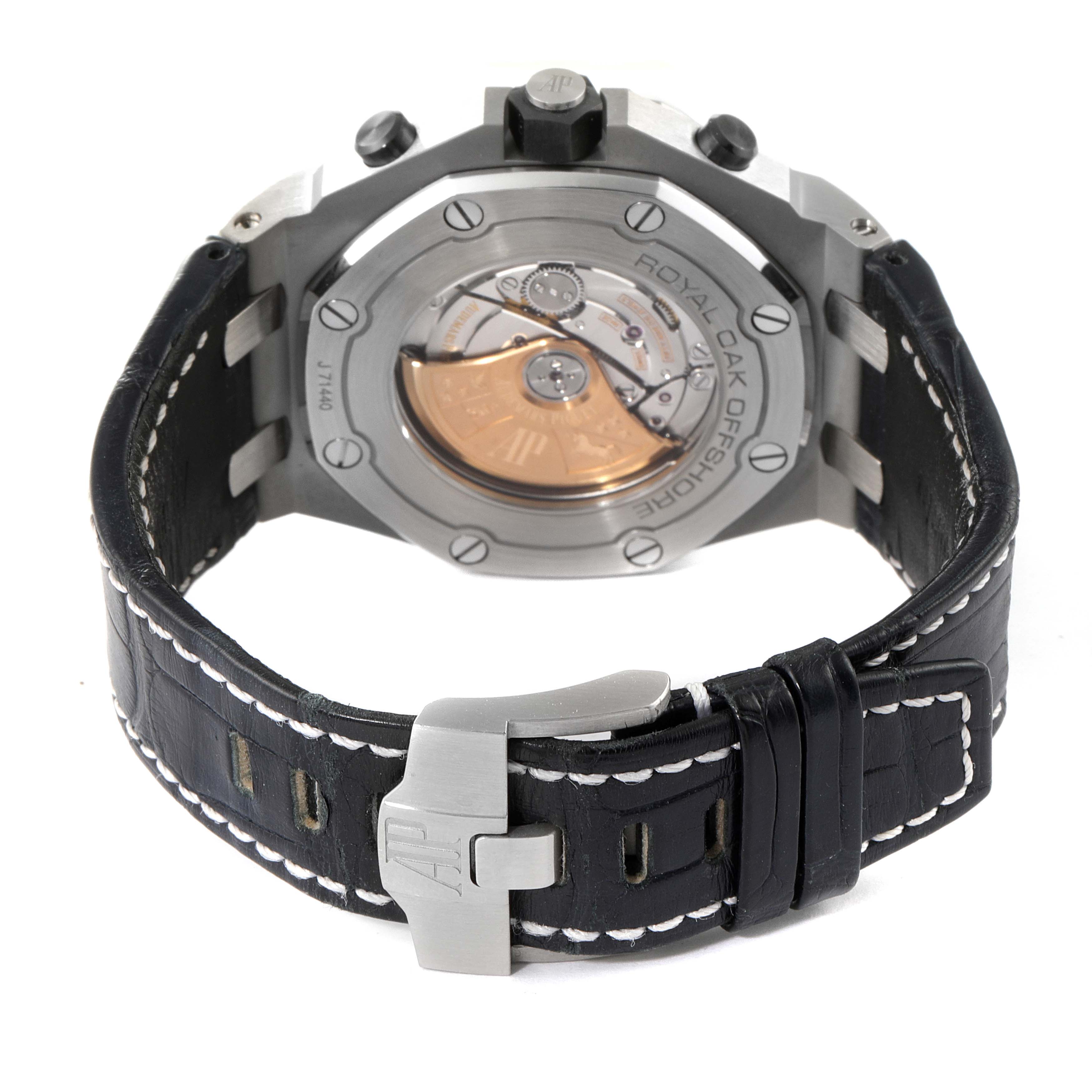 The image shows the back view of an Audemars Piguet Royal Oak Offshore 26470ST.OO.A028CR.01 Men's Stainless Steel Black Dial 26470ST.OO.A028CR.01 Men's Stainless Steel Black Dial watch, highlighting its clasp, leather strap, and exposed automatic movement.