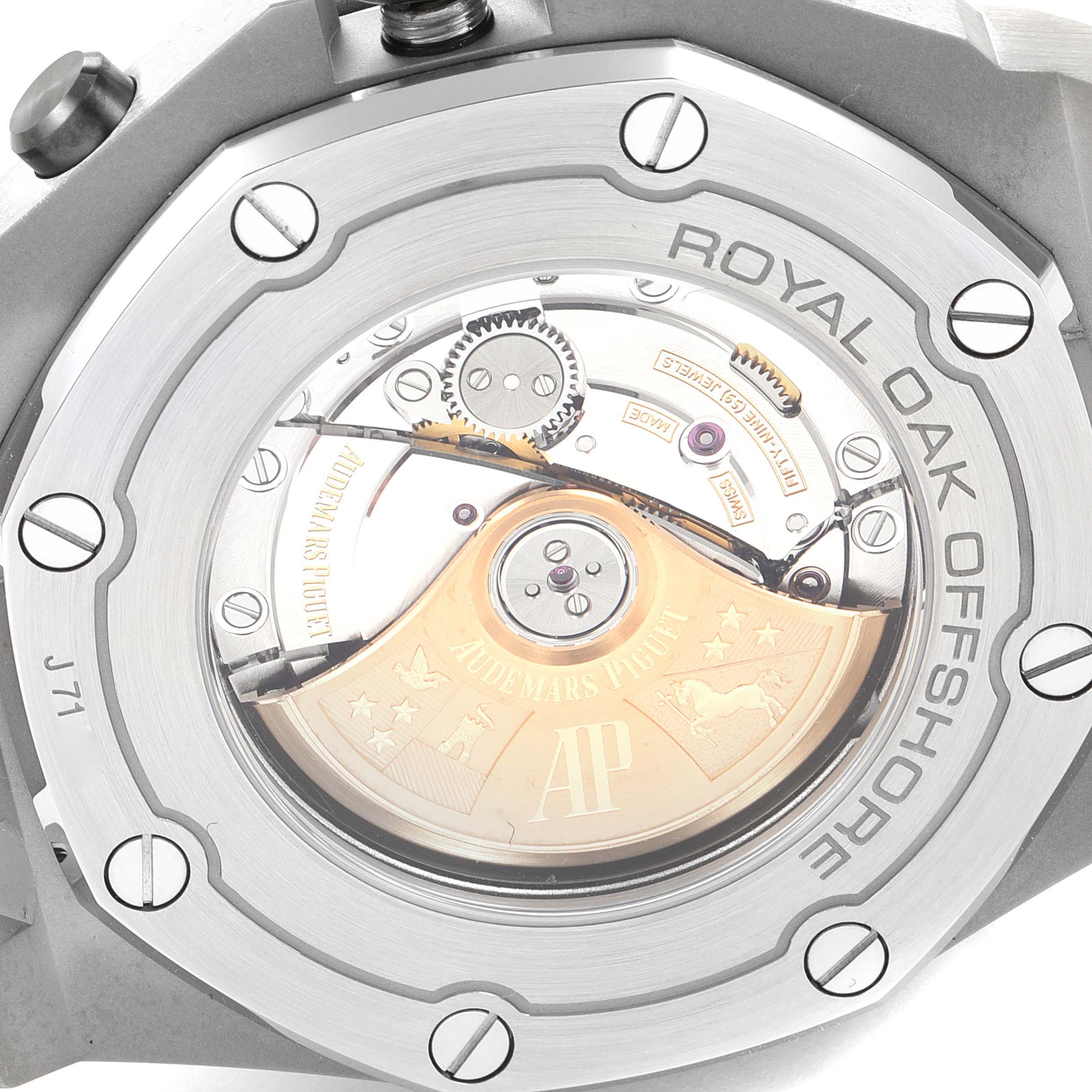 The image shows the back view of a Royal Oak Offshore model by Audemars Piguet, highlighting its movement and rotor.