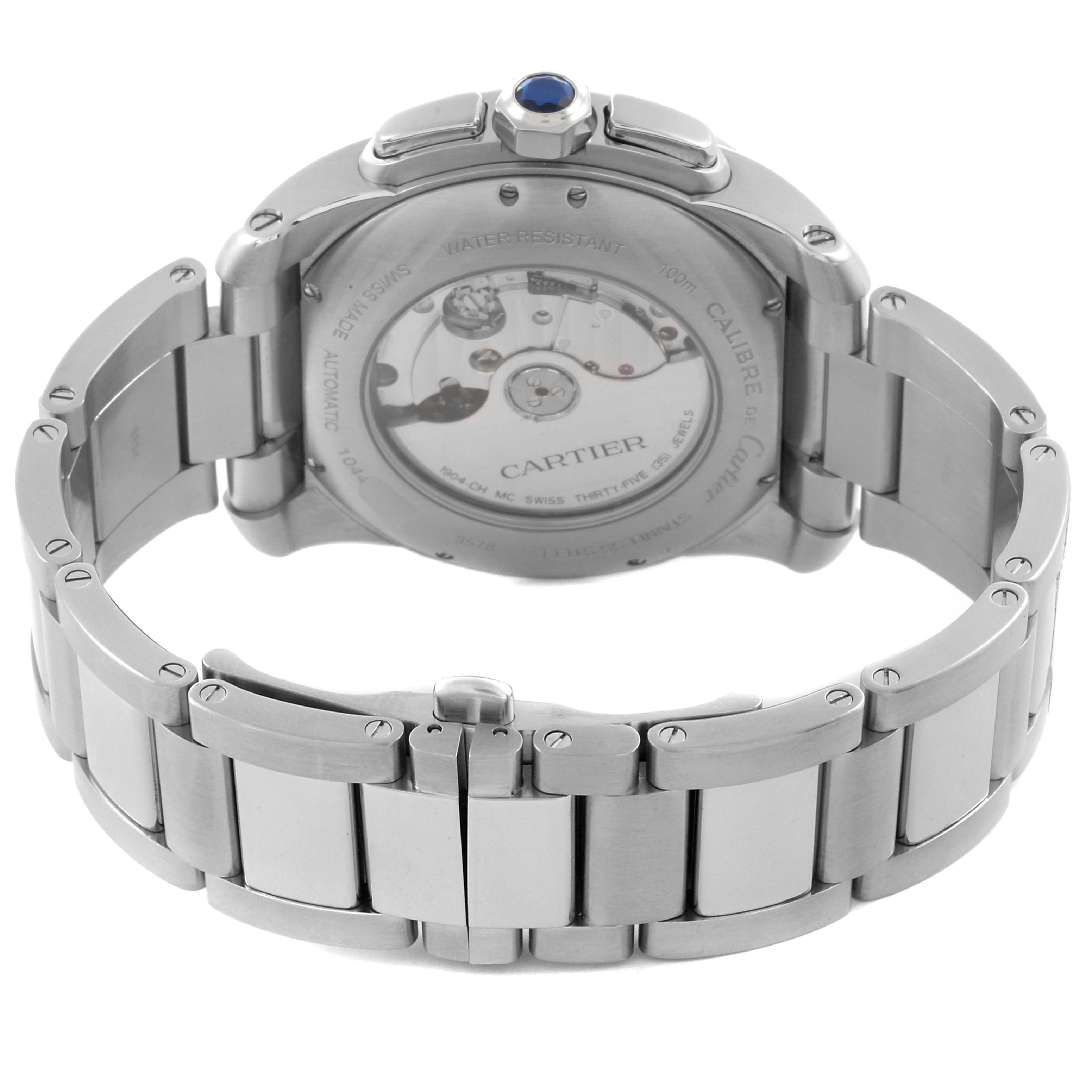 The Calibre de Cartier watch is shown from the back, highlighting the case back, bracelet, and movement details.
