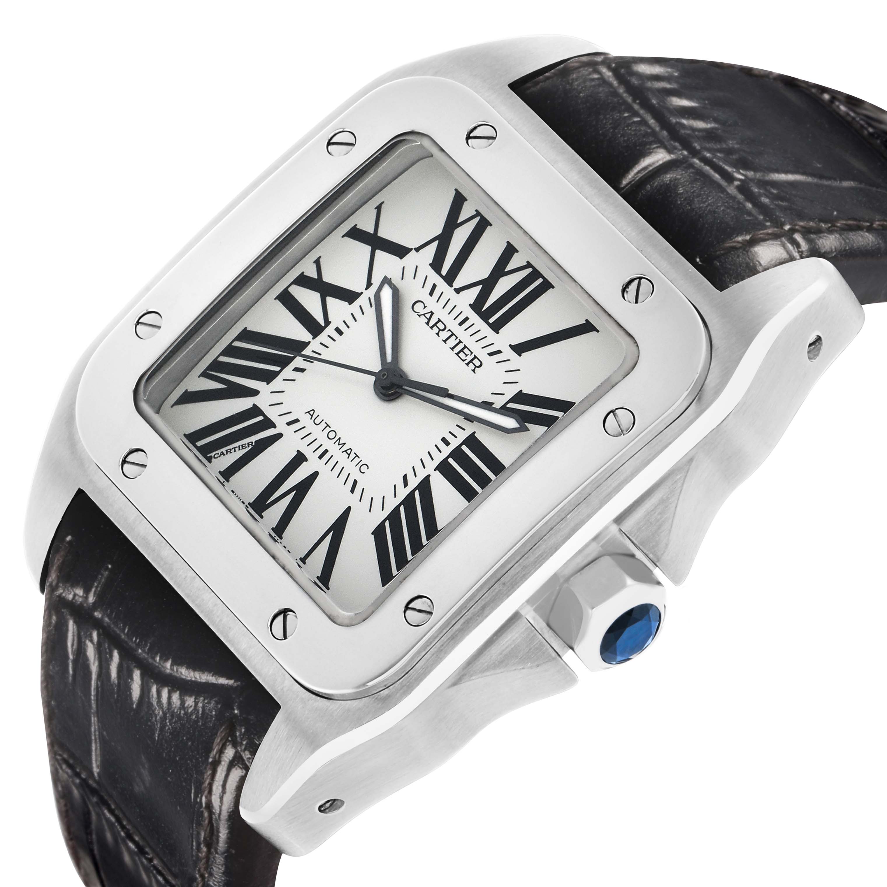 The Cartier Santos W20073X8 Men's Stainless Steel Silver Dial watch is shown at a slight angle, highlighting the face, case, crown, and part of the leather strap.