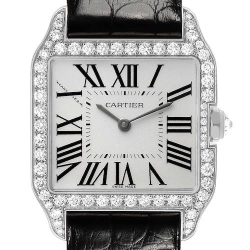 The Cartier Santos Dumont WH100251 Men's White Gold Silver Dial watch is shown from the front, highlighting the dial, Roman numerals, bejeweled bezel, and leather strap.