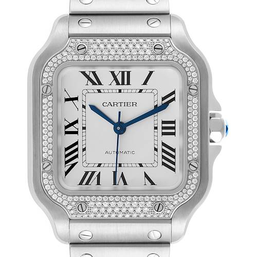 The Cartier Santos watch is shown front-facing, highlighting the dial, bezel, and part of the metal bracelet.