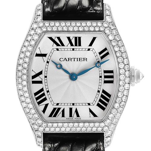 The Cartier Tortue WA504351 Men's White Gold Silver Dial watch is shown from the front, featuring a diamond-encrusted bezel, Roman numerals, and a leather strap.