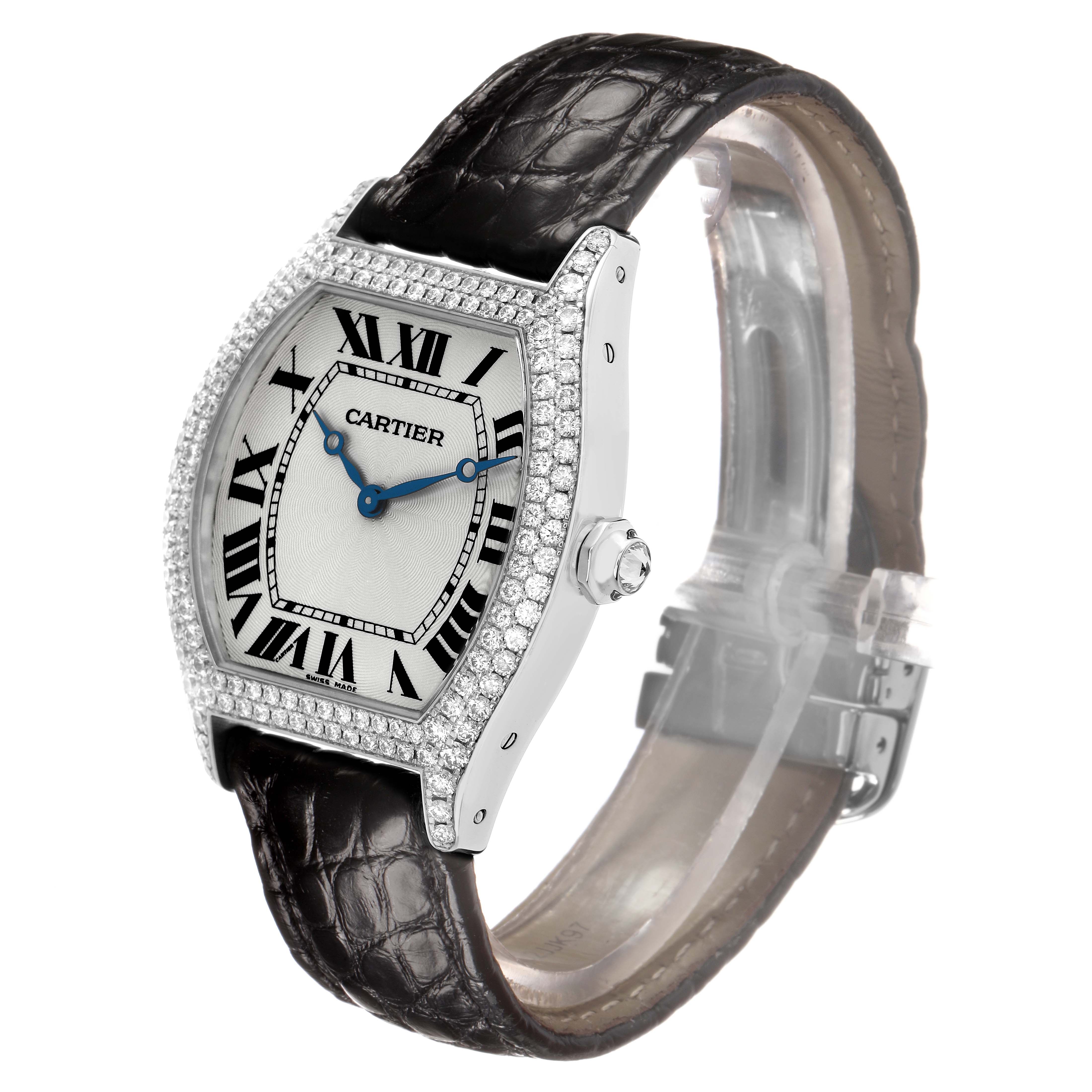 The Cartier Tortue WA504351 Men's White Gold Silver Dial watch is shown at a three-quarter angle, displaying the face, case, crown, and leather strap.