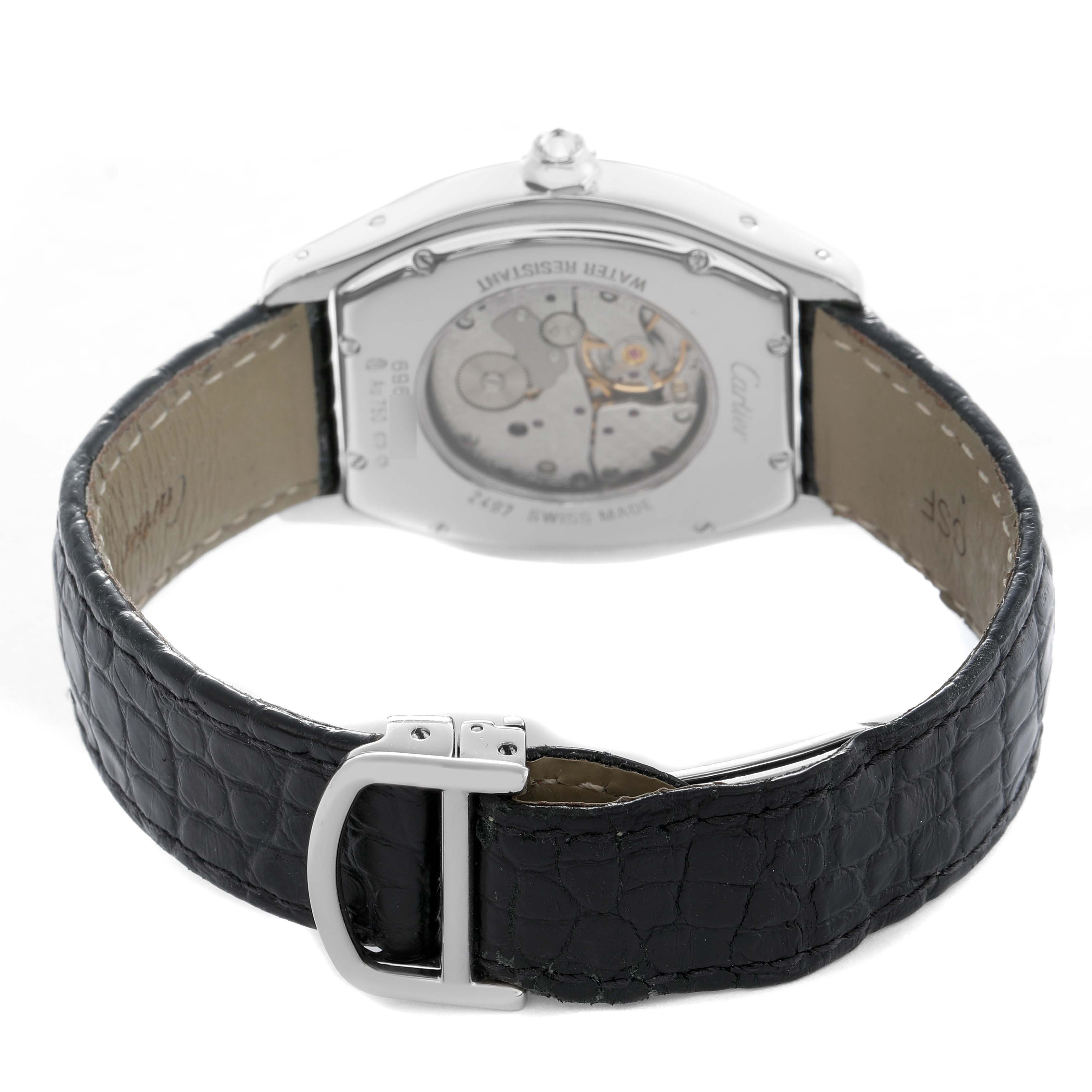 The image shows the back view of the Cartier Tortue WA504351 Men's White Gold Silver Dial watch, revealing its mechanical movement and black leather strap.