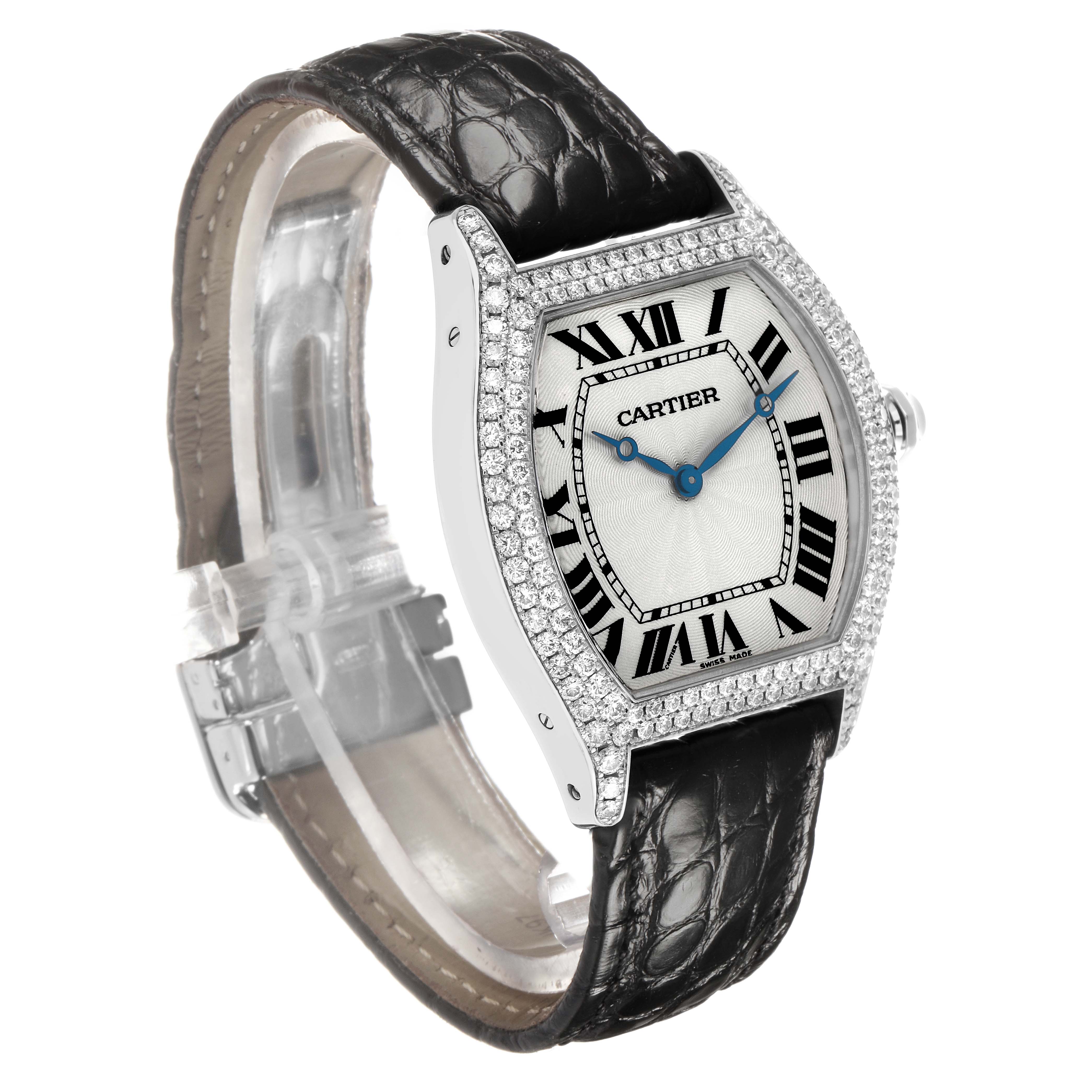 The Cartier Tortue WA504351 Men's White Gold Silver Dial watch is shown at a slight angle, displaying the face, diamond-set bezel, and black leather strap.