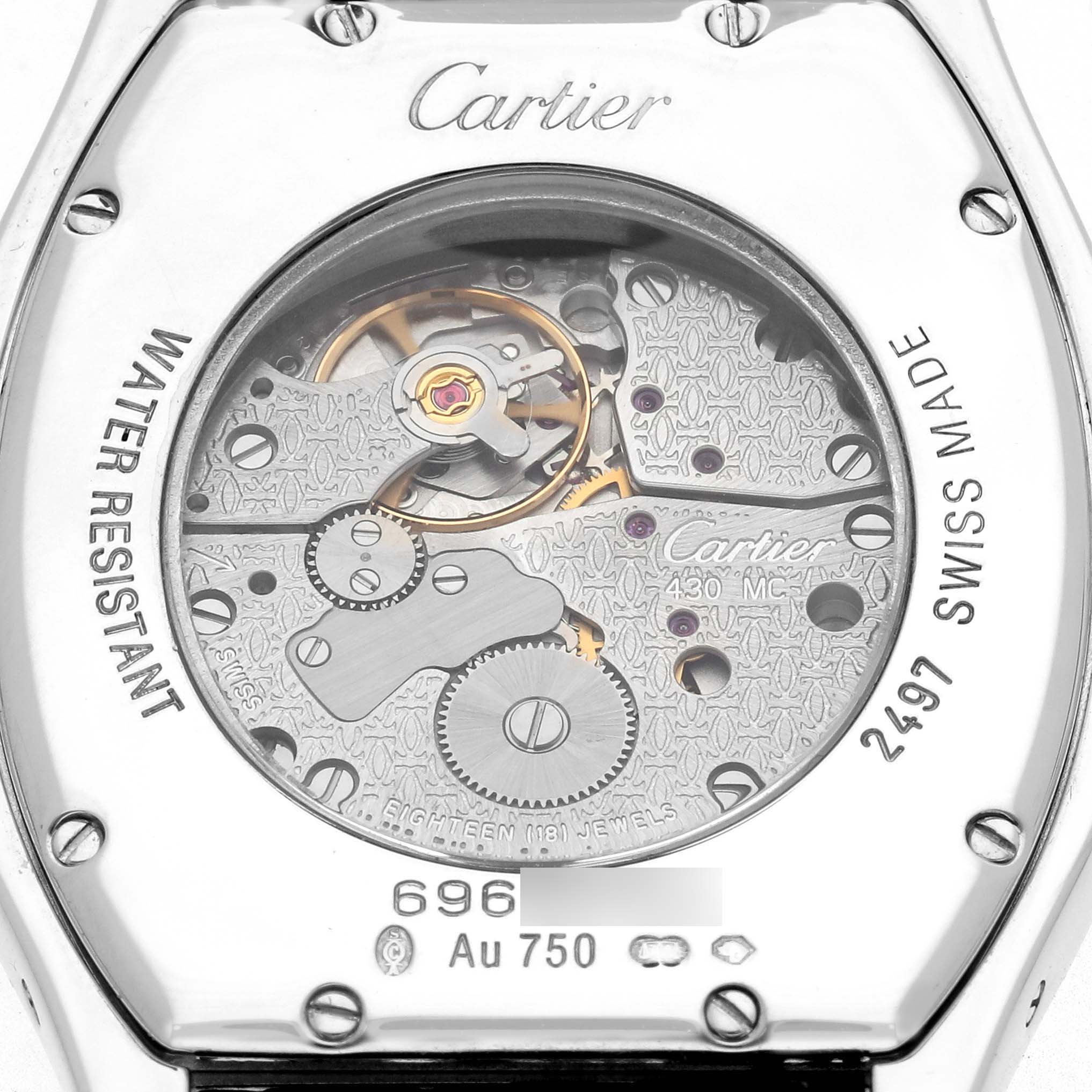 The image shows the back view of a Cartier Tortue WA504351 Men's White Gold Silver Dial watch, highlighting its intricate mechanical movement.