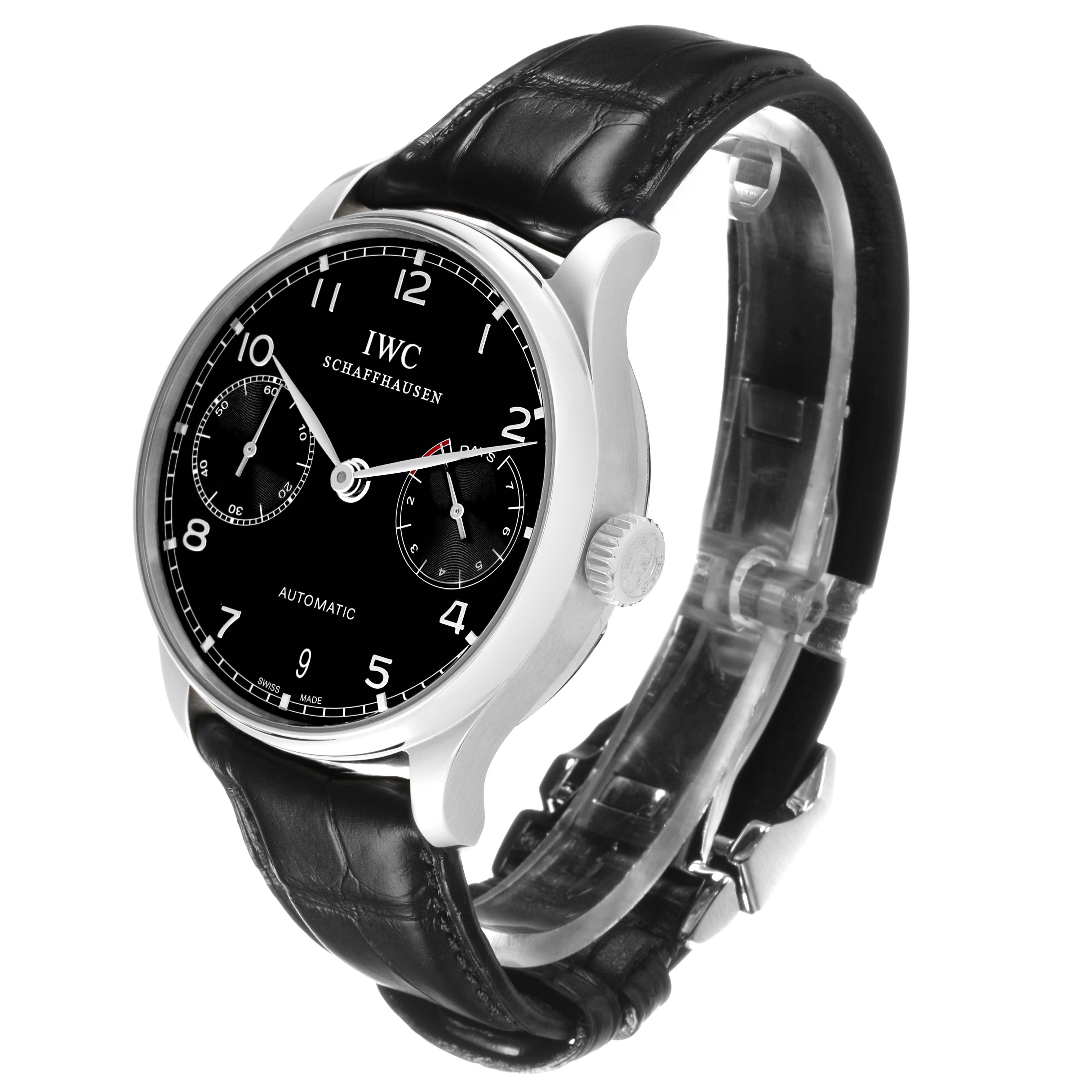 The IWC Portuguese IW500703 Men's Stainless Steel Black Dial watch is shown at a three-quarter angle, highlighting the black dial, case, crown, and leather strap.