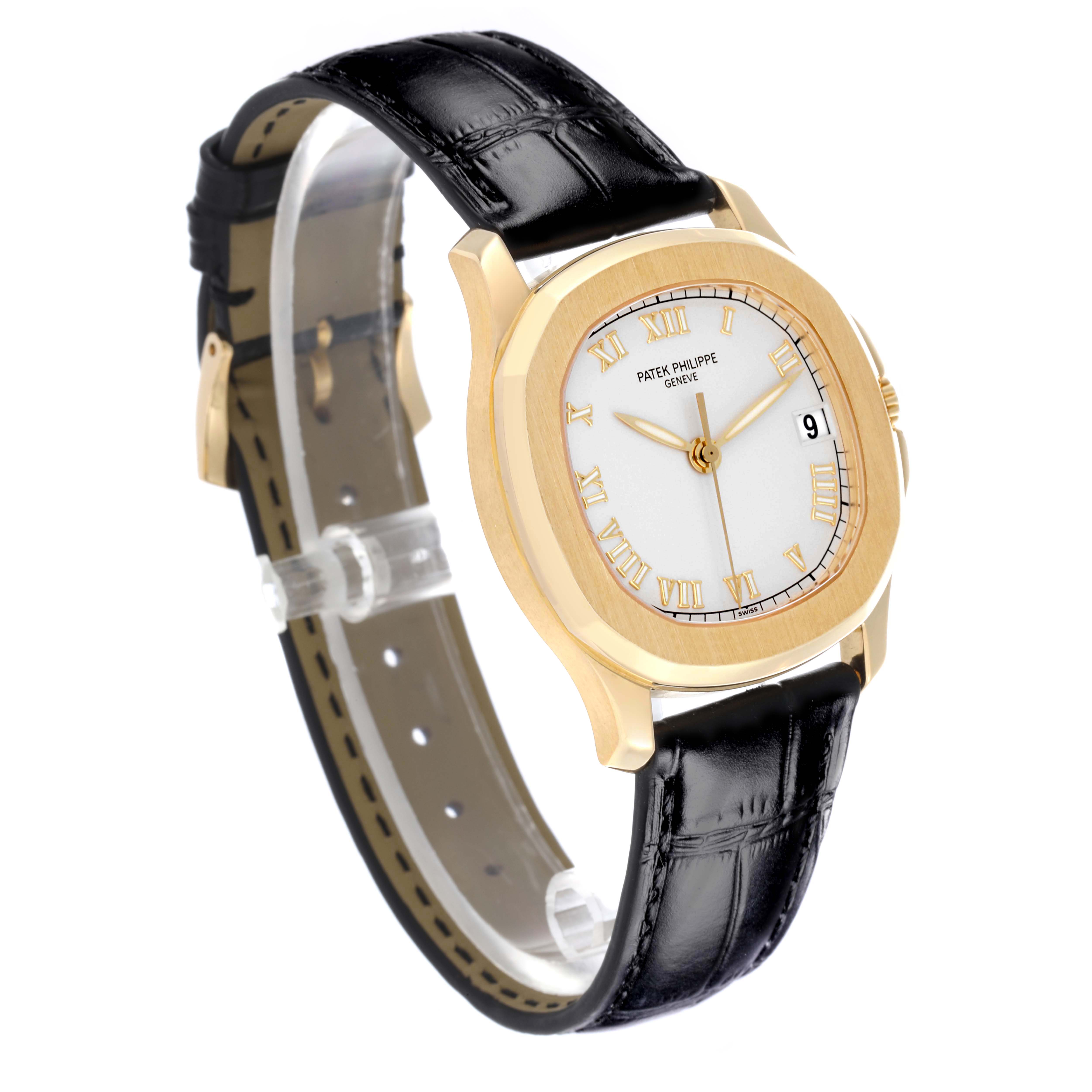 The Patek Philippe Aquanaut 5060 Men's Yellow Gold Silver Dial 5060 Men's Yellow Gold Silver Dial watch is shown at an angled view, highlighting its gold case, white dial, and black leather strap.
