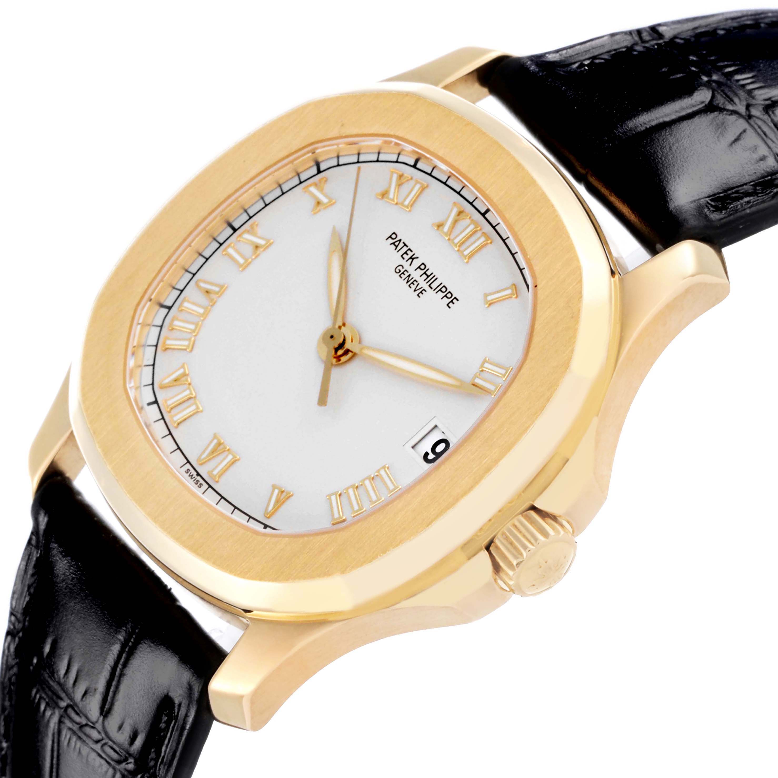 The Patek Philippe Aquanaut 5060 Men's Yellow Gold Silver Dial 5060 Men's Yellow Gold Silver Dial watch is shown at an angled view highlighting the face, bezel, crown, and part of the strap.
