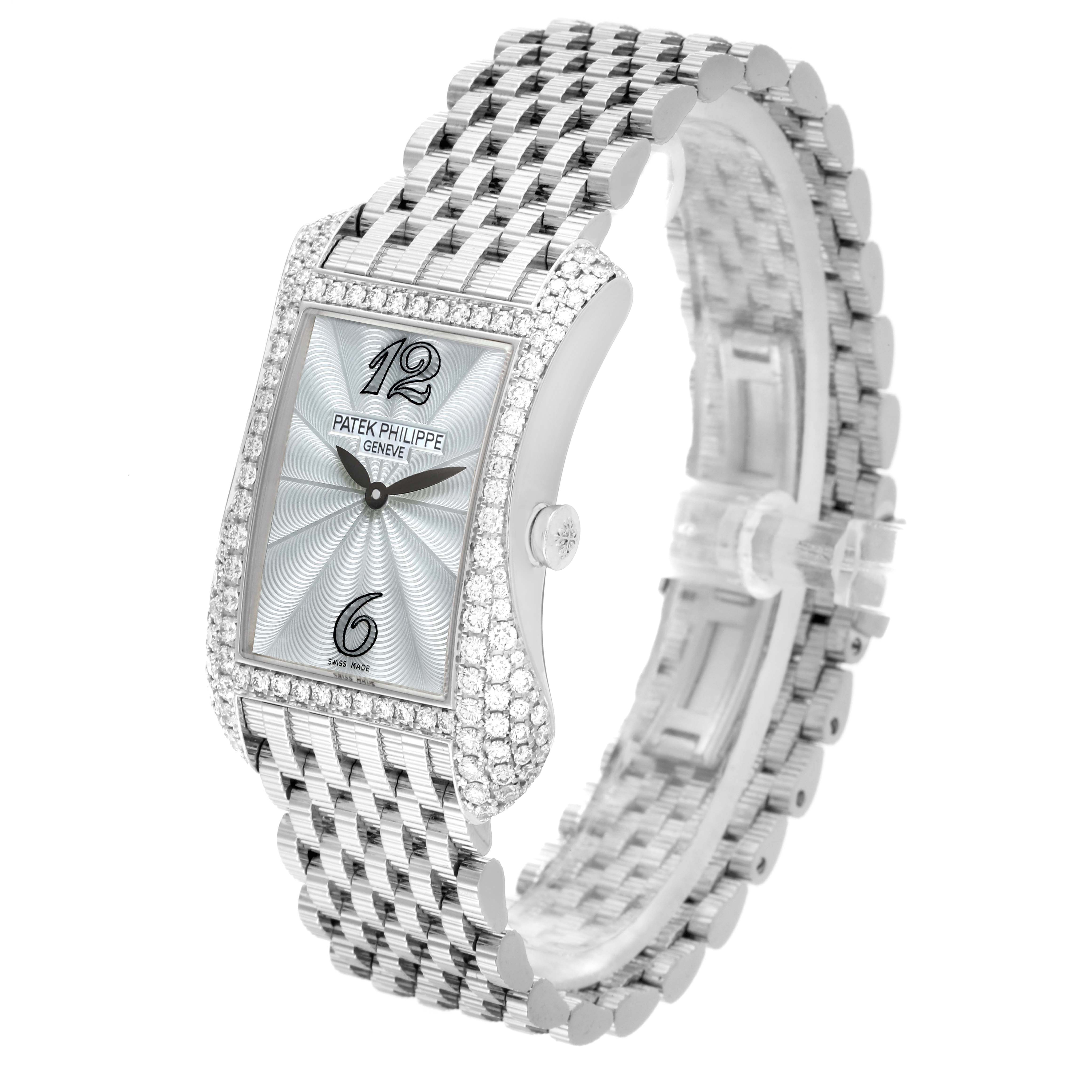 The Patek Philippe Gondolo 4972/1G-001 Women
s White Gold Mother of Pearl Dial watch is shown at an angled view, highlighting its diamond-studded bezel, face, and metal bracelet.