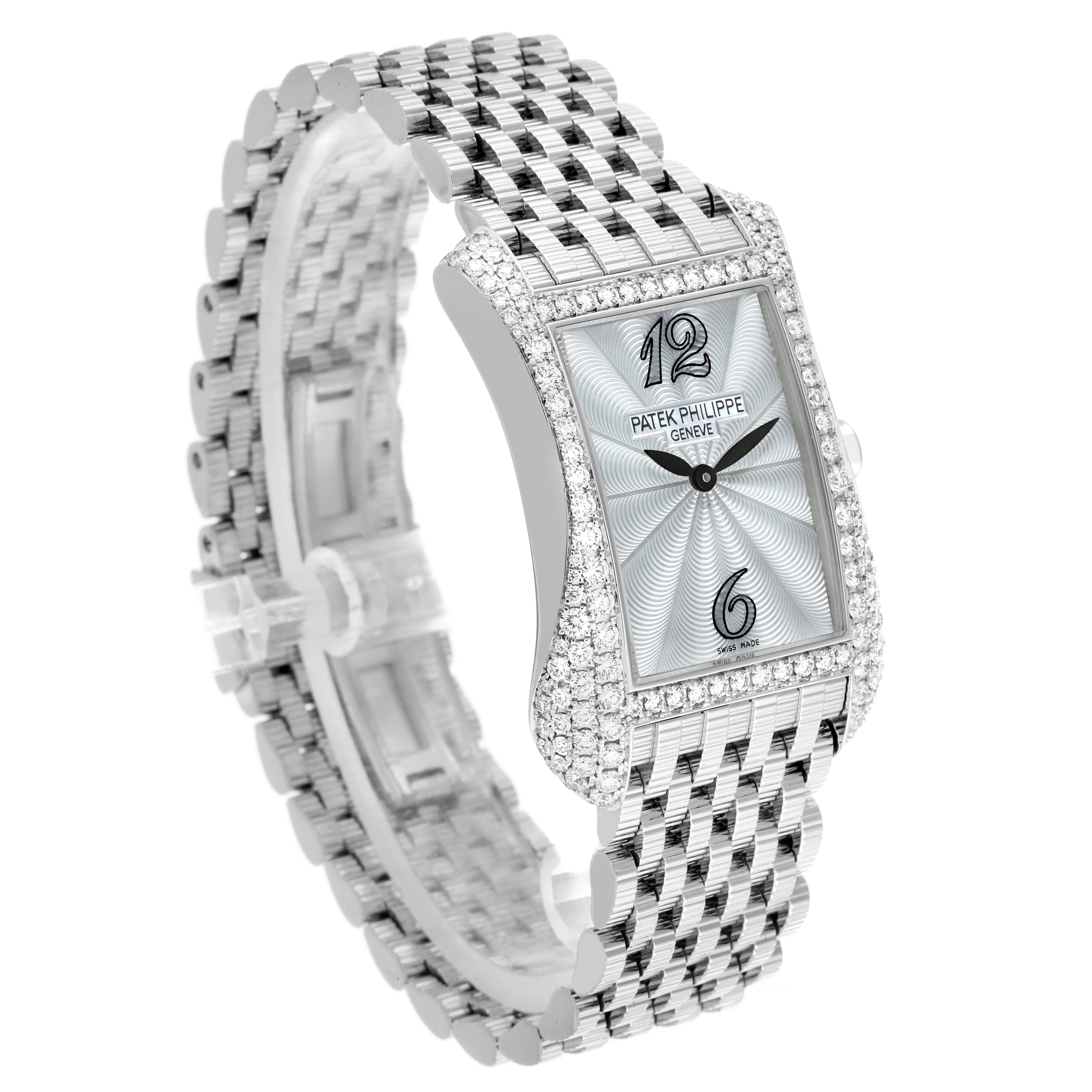 The Patek Philippe Gondolo 4972/1G-001 Women
s White Gold Mother of Pearl Dial watch is shown at a three-quarter angle, highlighting its diamond-encrusted rectangular case and metal bracelet.