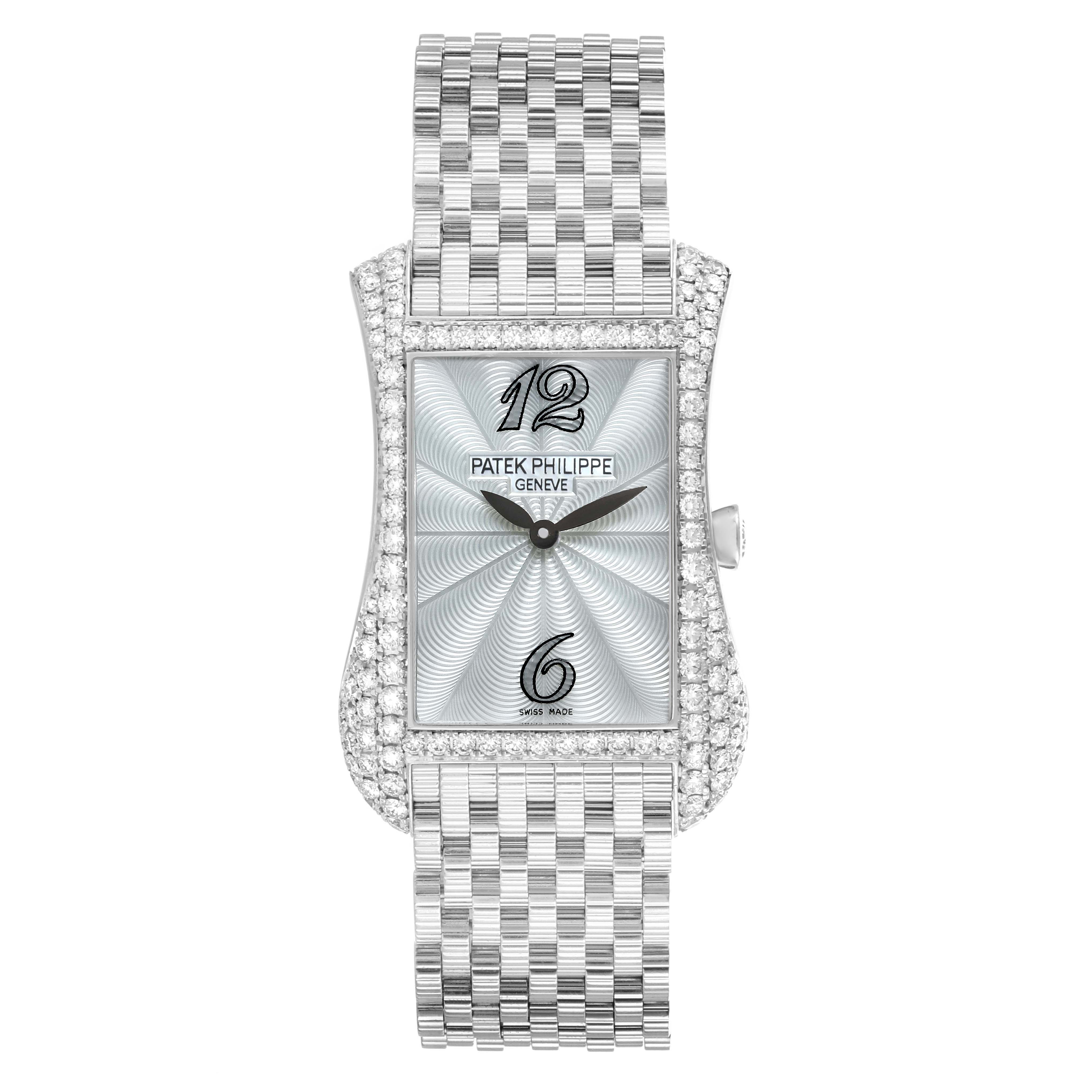 The Patek Philippe Gondolo 4972/1G-001 Women
s White Gold Mother of Pearl Dial watch is shown from a top-down view, highlighting its rectangular, diamond-studded case and metal bracelet.