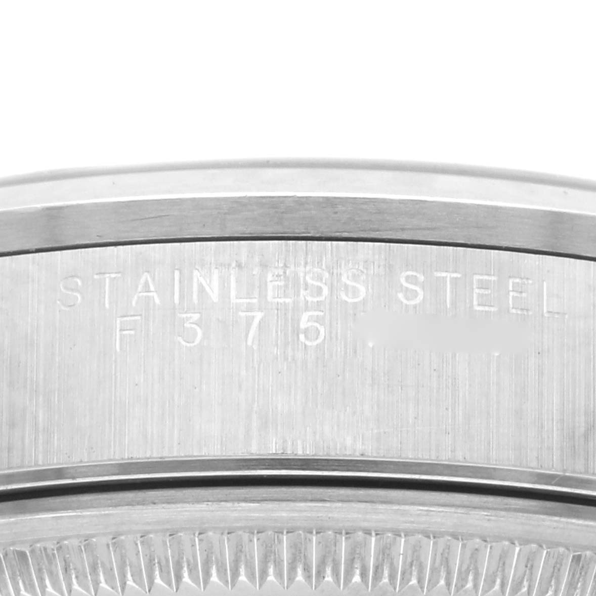 The image shows a close-up of the case side of a Rolex Air-King 14000M Men's Stainless Steel Black Dial 14000M Men's Stainless Steel Black Dial, highlighting the "Stainless Steel" engraving.