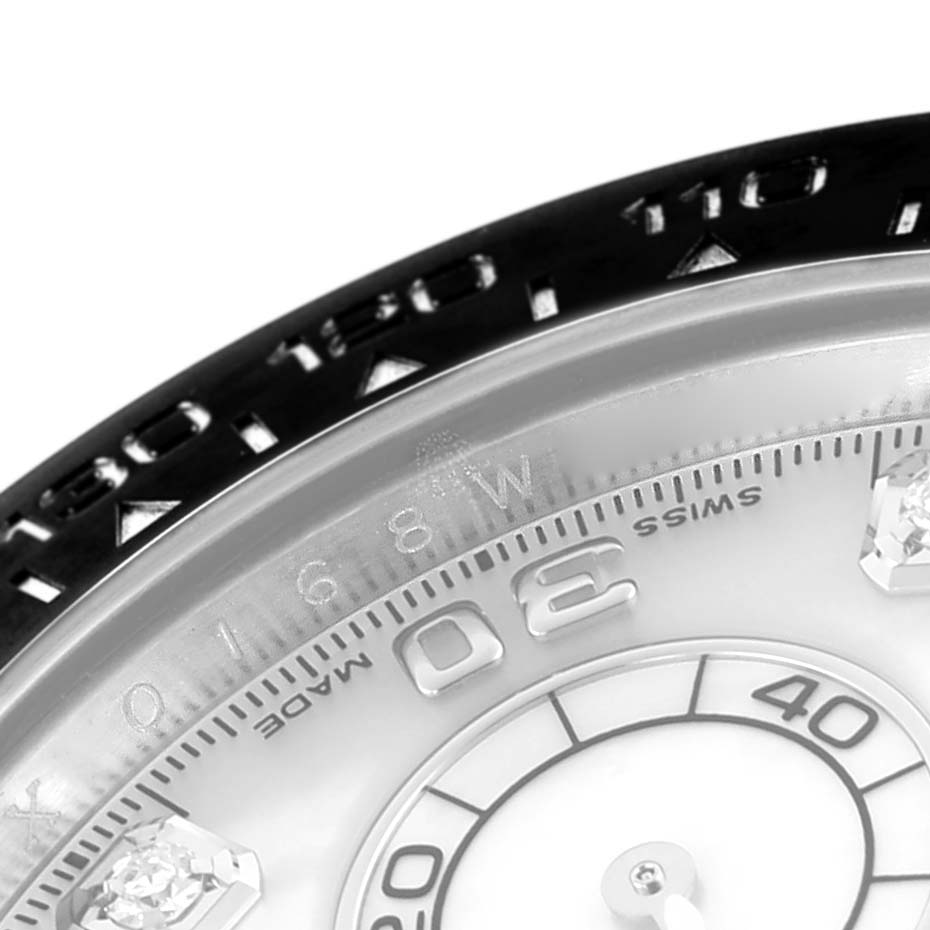 The image shows a close-up of the bezel and dial of a Rolex Daytona 116519LN Men's White Gold Mother of Pearl Dial 116519LN Men's White Gold Mother of Pearl Dial watch, highlighting numerals and design elements.