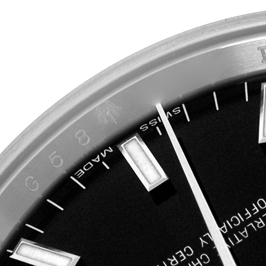 The image shows a close-up of the Rolex Date 115200 Men's Stainless Steel Black Dial 115200 Men's Stainless Steel Black Dial watch face, highlighting the dial, markers, and part of the bezel.