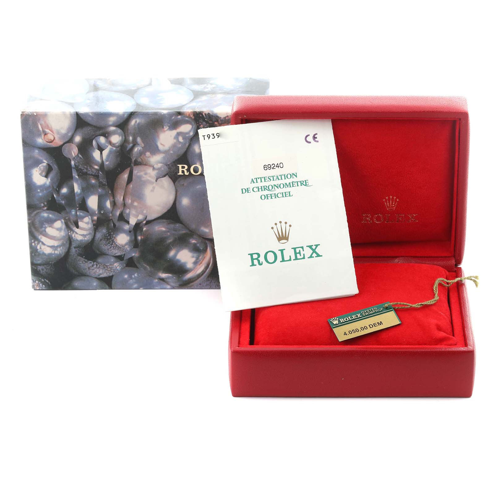 The image shows the packaging and certificate of a Rolex Date 69240 Women's Stainless Steel Blue Dial 69240 Women's Stainless Steel Blue Dial model watch, with a tag and box.