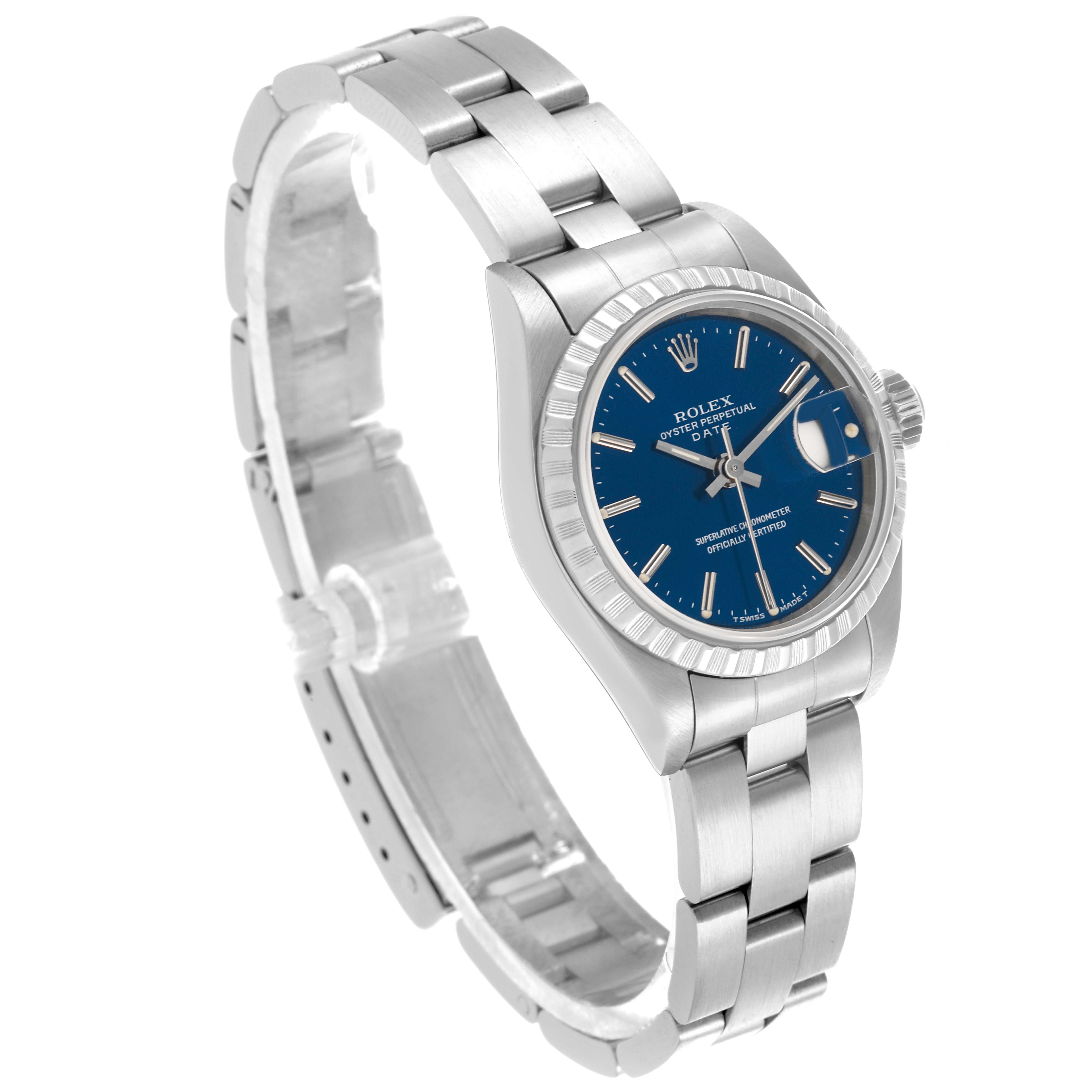 The Rolex Date 69240 Women's Stainless Steel Blue Dial 69240 Women's Stainless Steel Blue Dial watch is shown at a tilted angle highlighting the bracelet, case, bezel, and blue dial.
