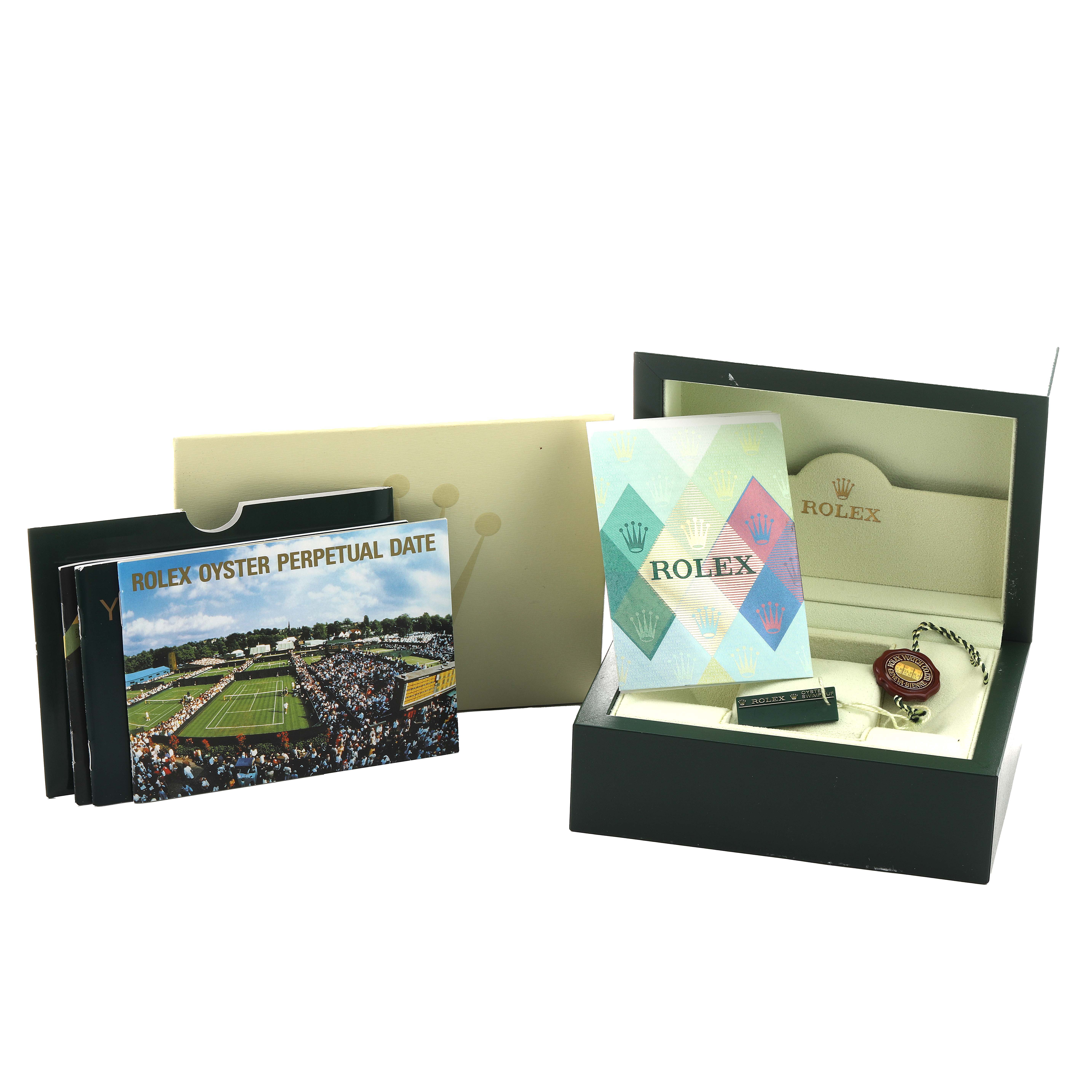 The image shows the Rolex Date 79240 Women's Stainless Steel White Dial model packaging, including booklets, warranty card, box, and tag from a top angle.