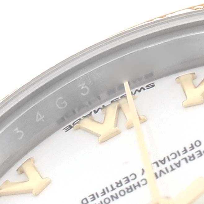 The image shows a close-up of the Rolex Datejust 279383RBR Women's Steel and Gold (two tone) White Dial 279383RBR Women's Steel and Gold (two tone) White Dial dial and part of the bezel, highlighting the hour markers and text.