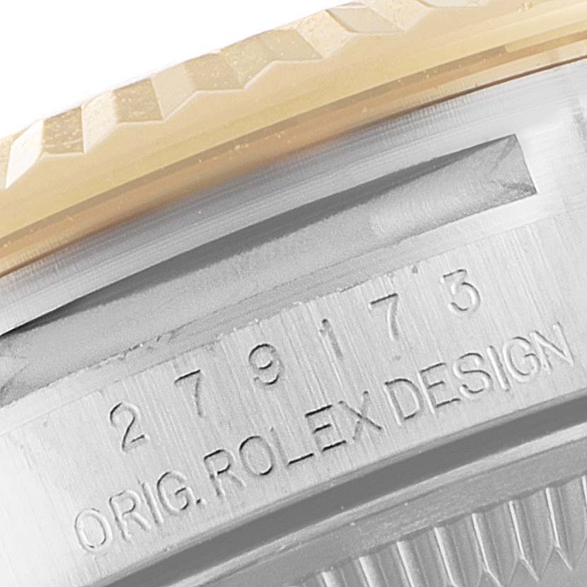This close-up angle shows the engraved serial number and part of the fluted bezel of a Rolex Datejust 279173 Women
s Steel and Gold (two tone) Green Dial 279173 Women
s Steel and Gold (two tone) Green Dial watch.