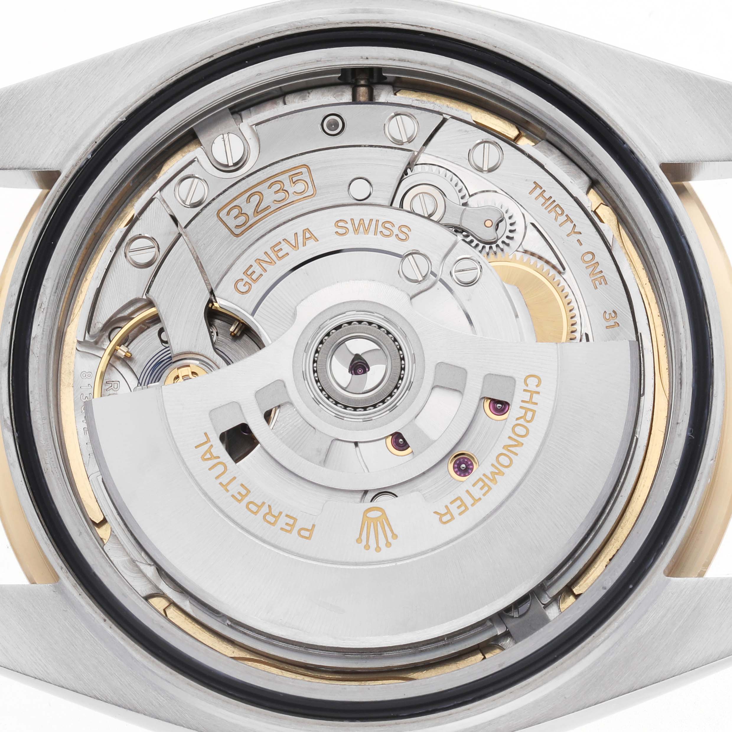 The image shows the movement of a Rolex Datejust 41 126333 Men's Steel and Gold (two tone) Champagne Dial, focusing on the detailed mechanics from the back.