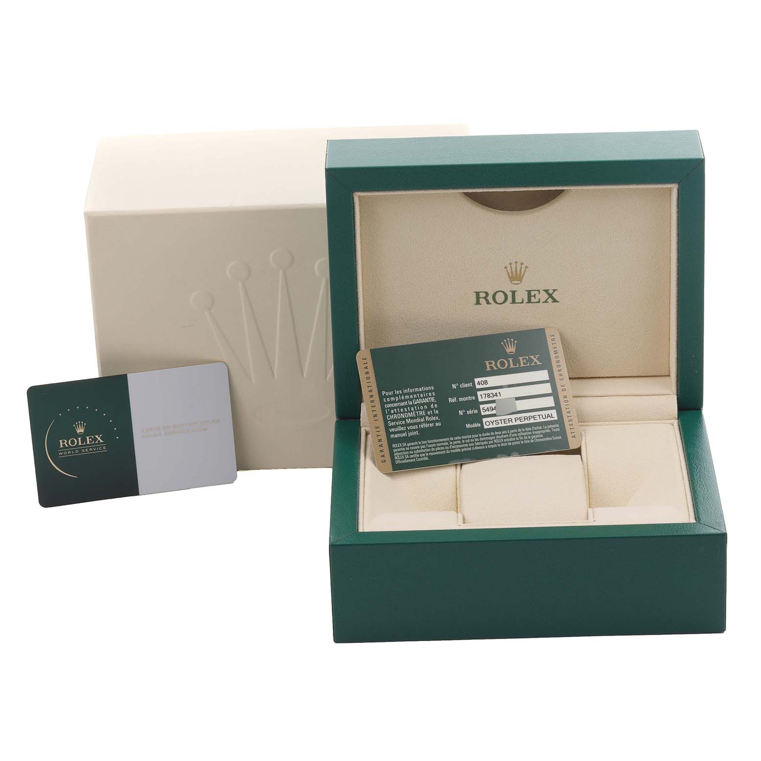 The image shows the packaging, warranty card, and box for a Rolex Datejust watch.