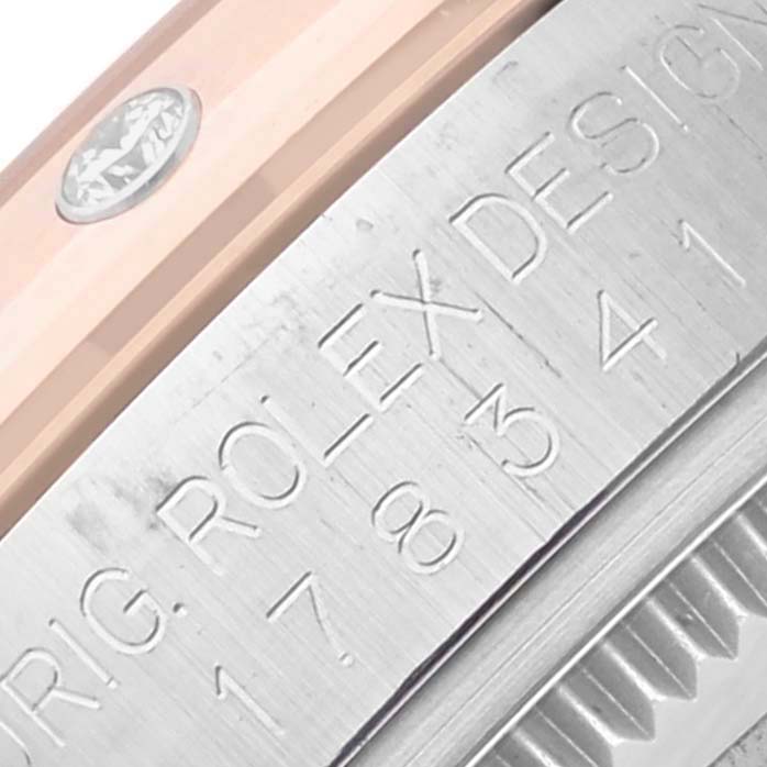 The image shows a close-up angle of the Rolex Datejust model casing with engraved text.