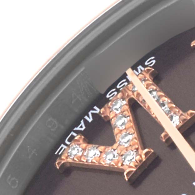 The image shows a close-up of the dial with diamond-studded Roman numeral and part of the bezel on a Rolex Datejust.