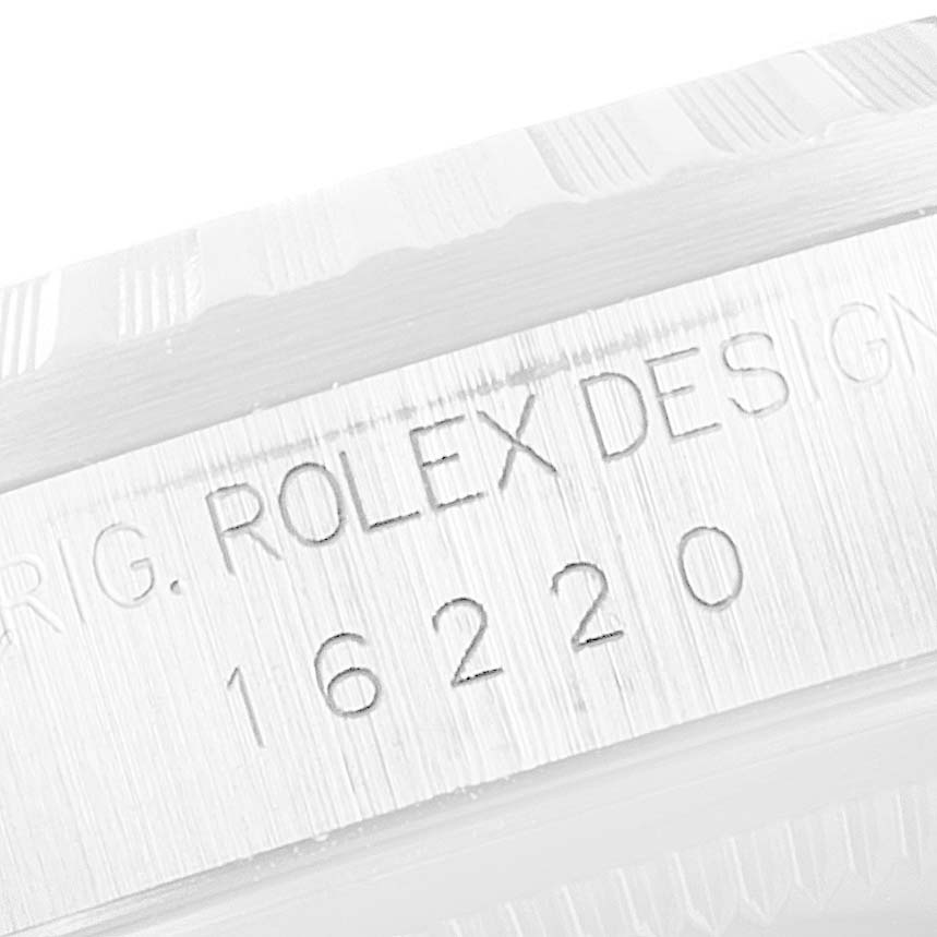 This image shows a close-up of the side of a Rolex Datejust 16220 Men's Stainless Steel Silver Dial 16220 Men's Stainless Steel Silver Dial watch, highlighting the engraved model number 16220.